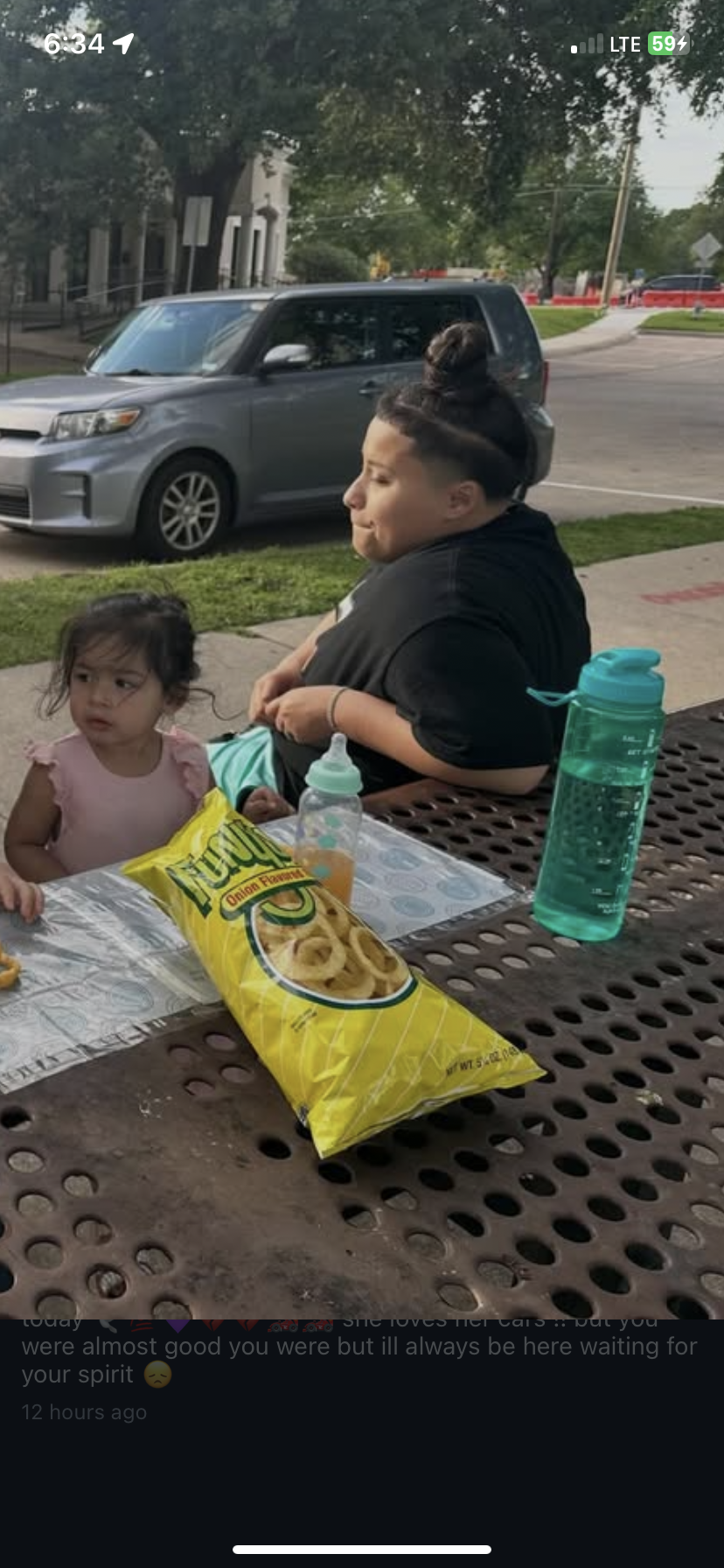 A woman and a child at a picnic table