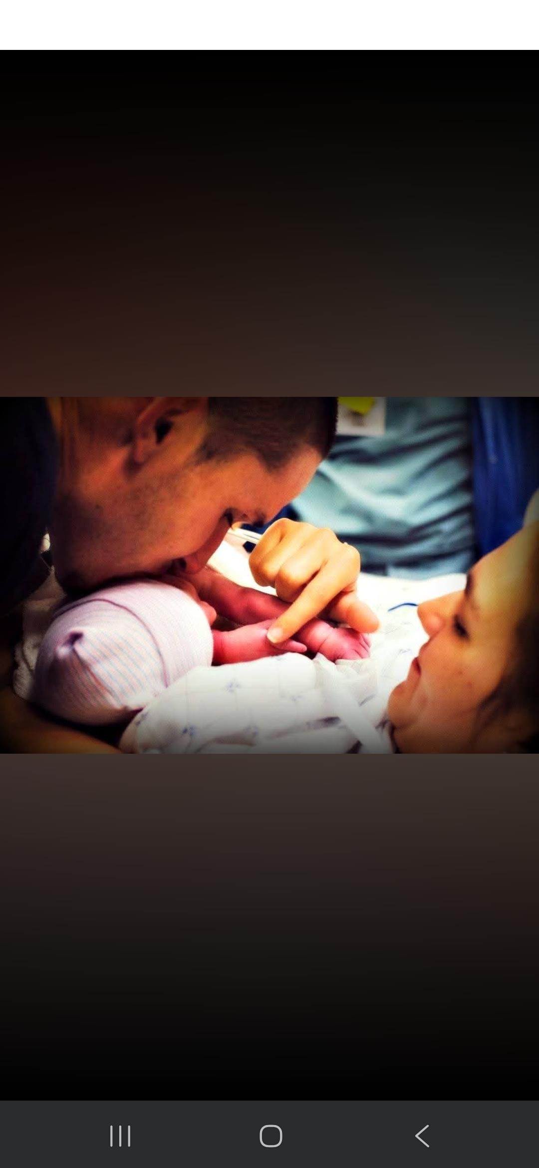 A man kissing a baby