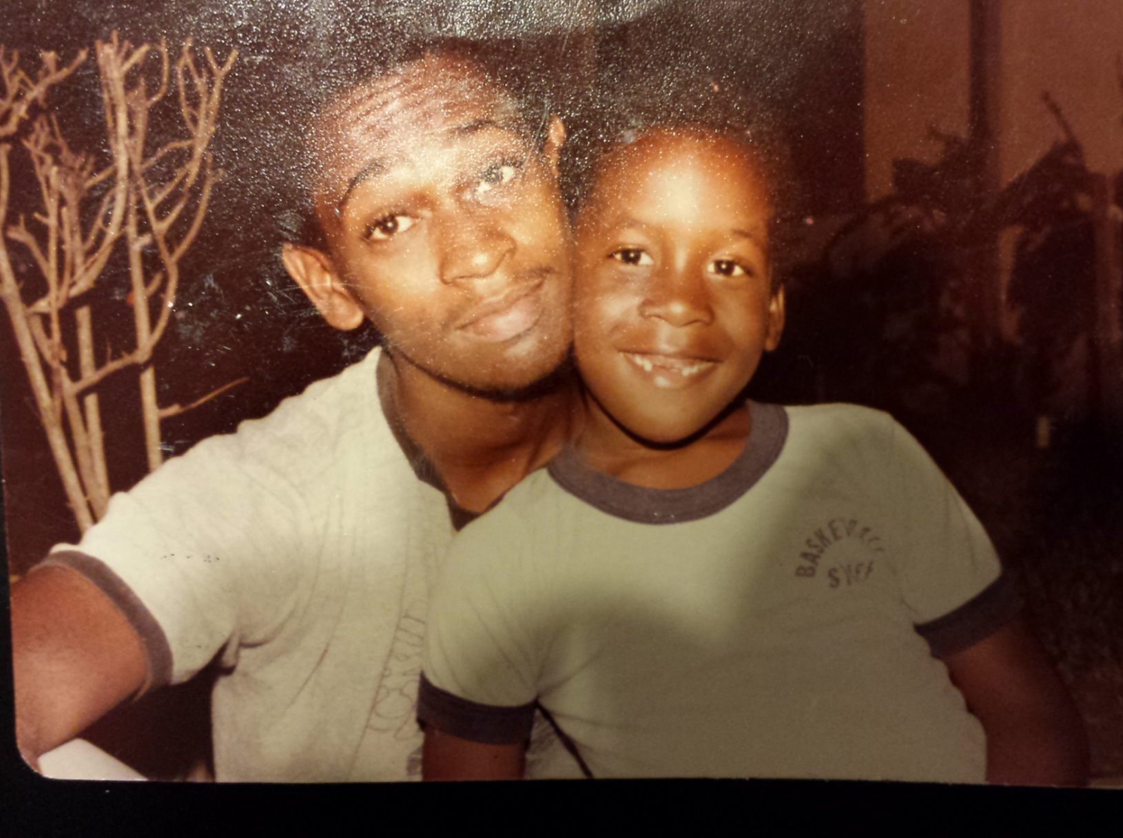 A man and boy posing for a picture