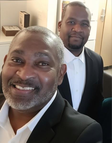 A group of men smiling for a selfie