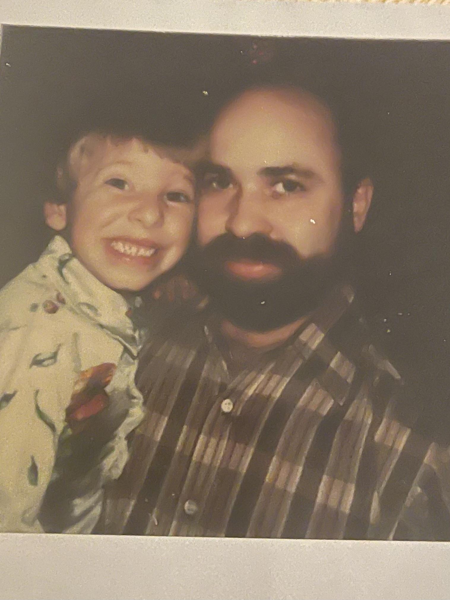 A man and child posing for a picture