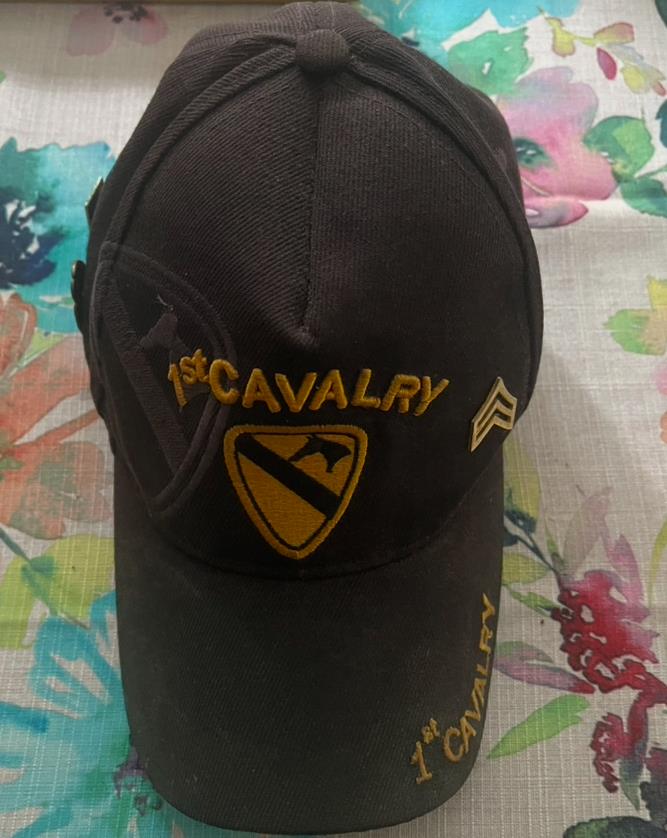 A black hat with yellow text on it