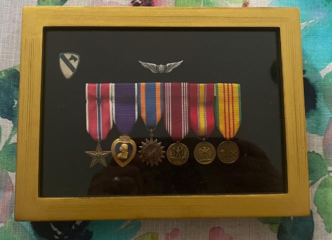 A group of medals in a frame