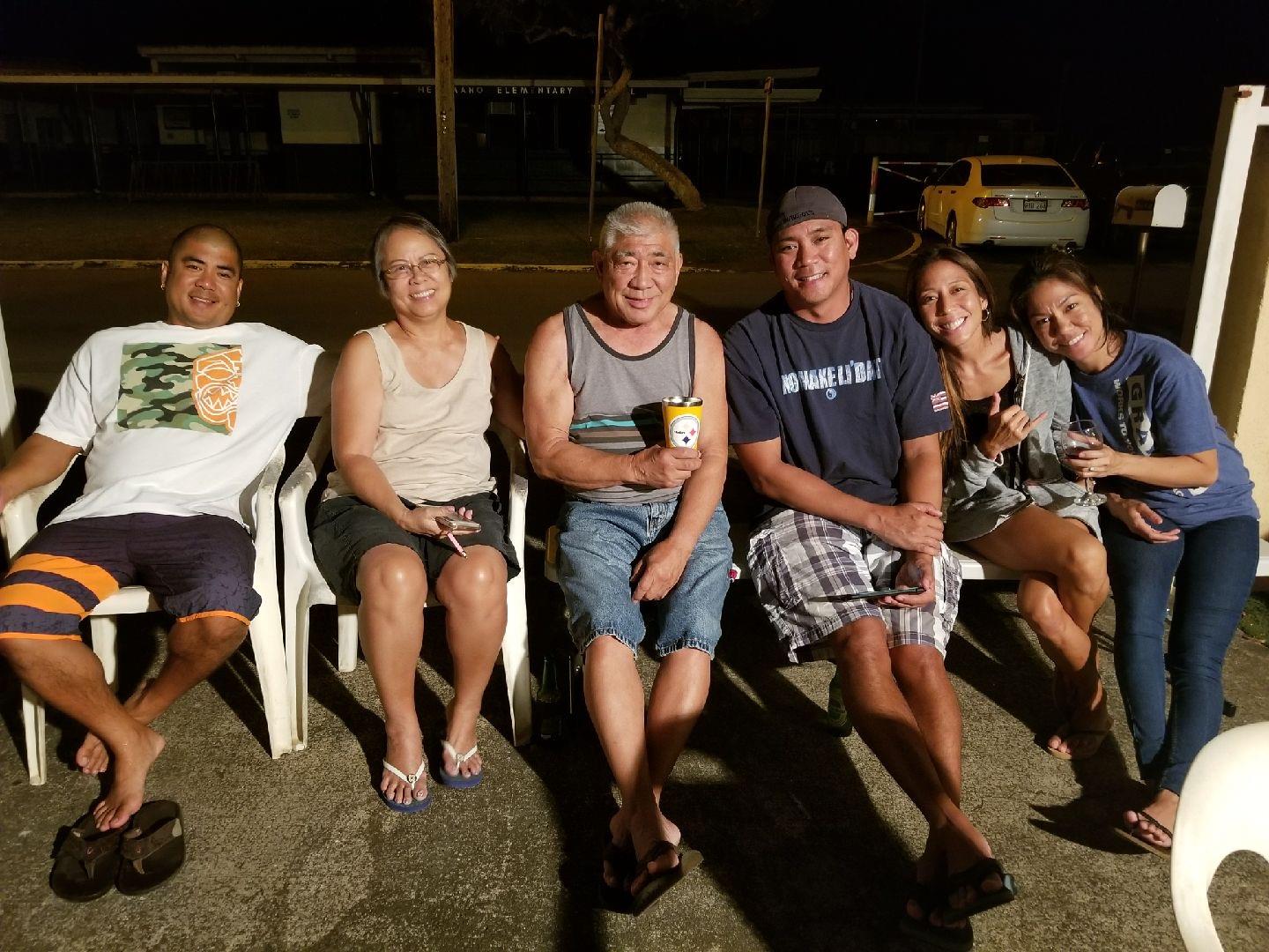 A group of people sitting in chairs