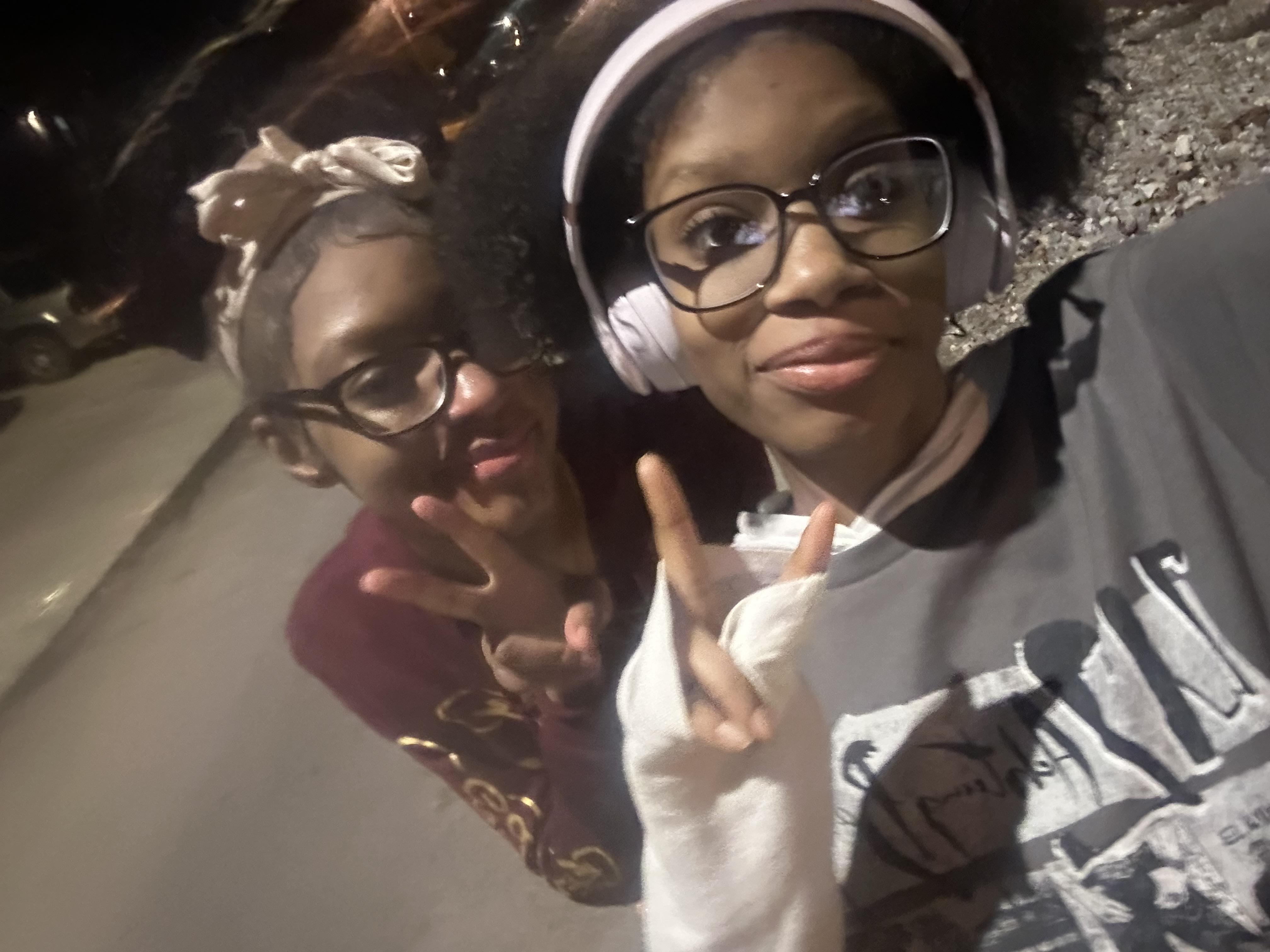 A couple of people posing for a selfie