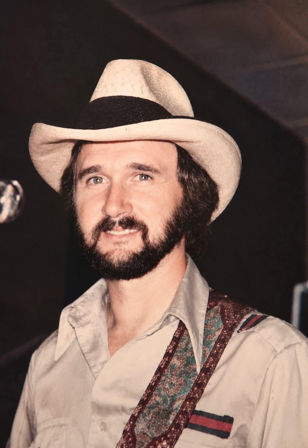 A man wearing a cowboy hat