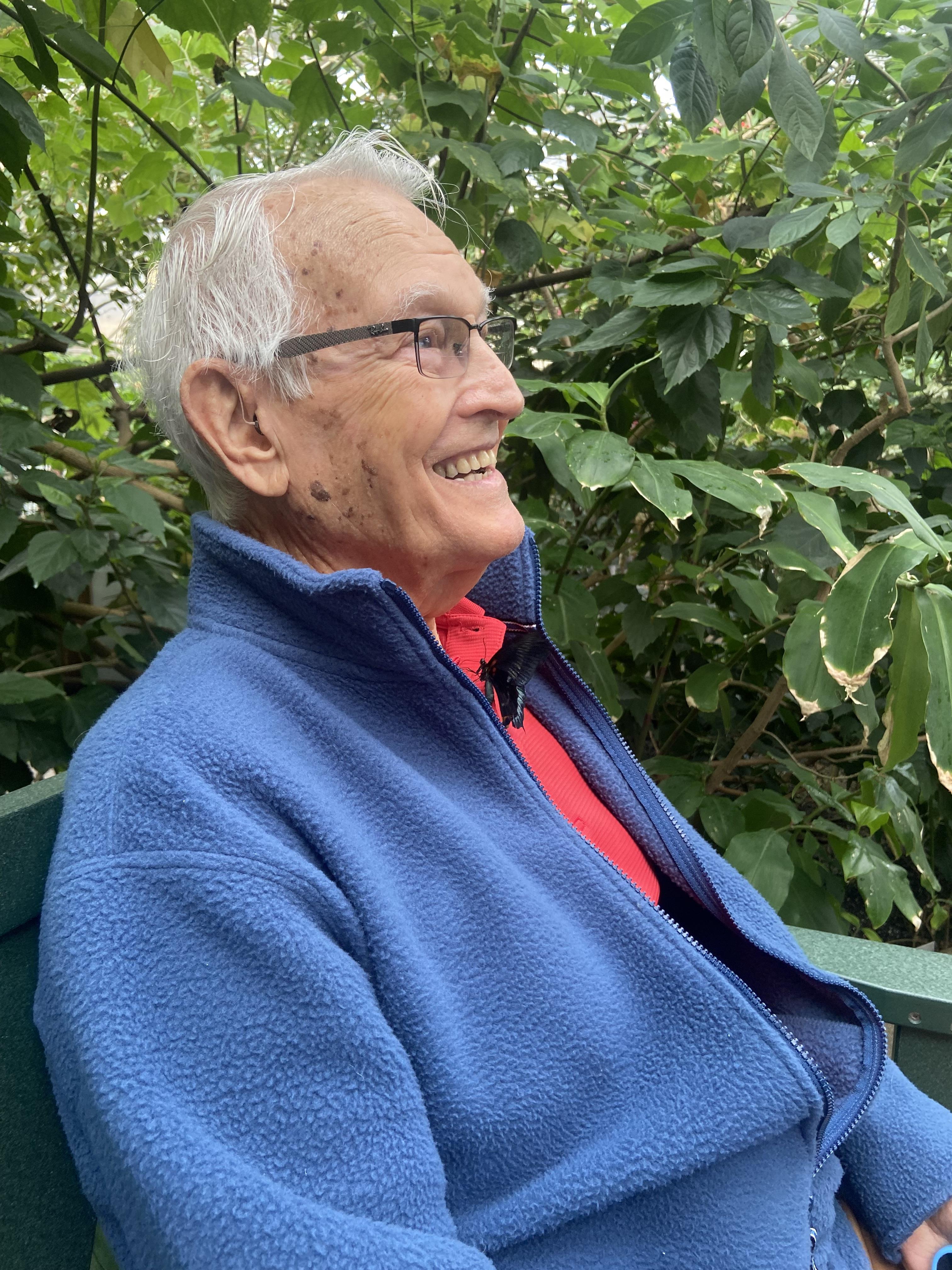 An old man sitting on a bench