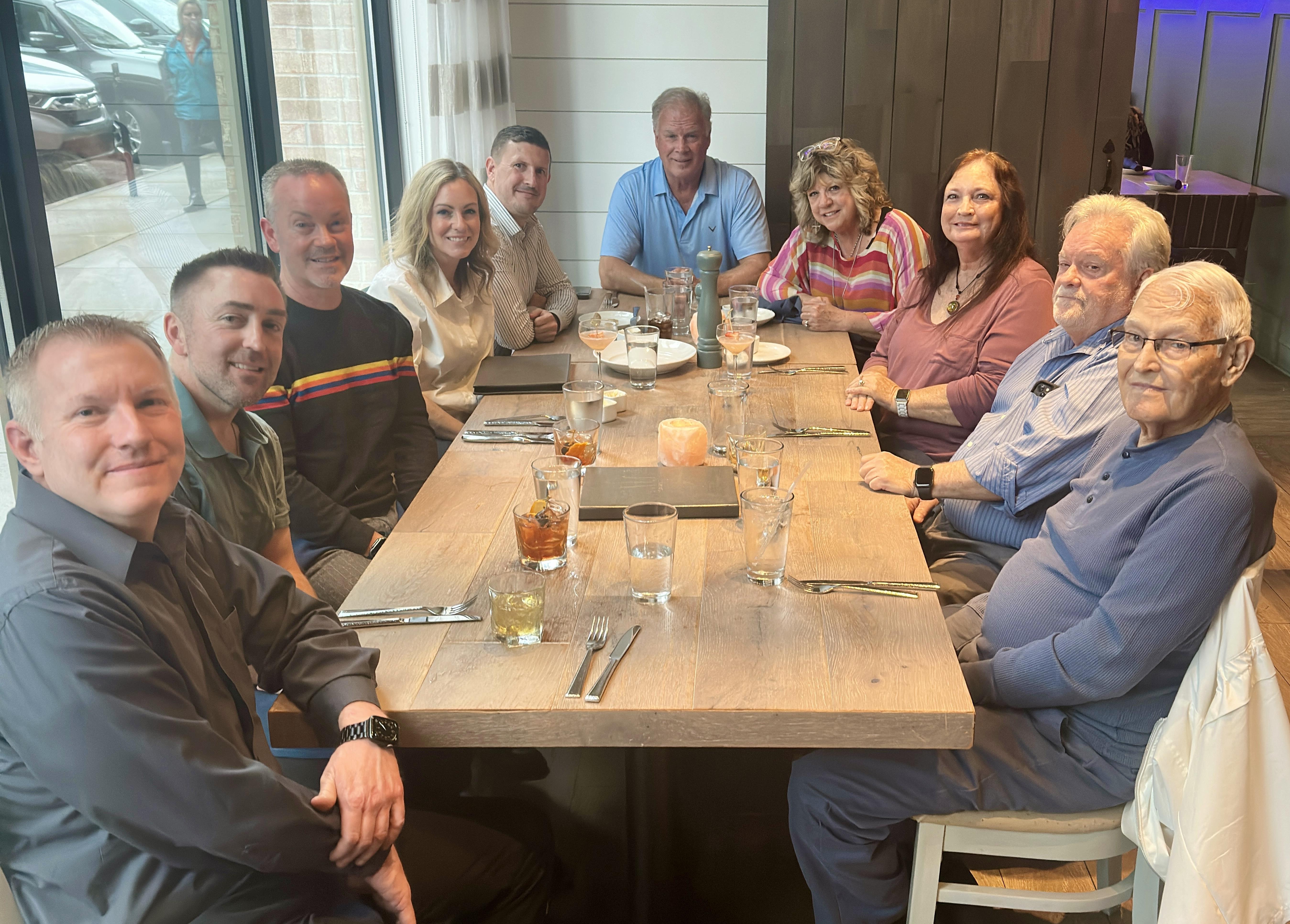 A group of people sitting around a table