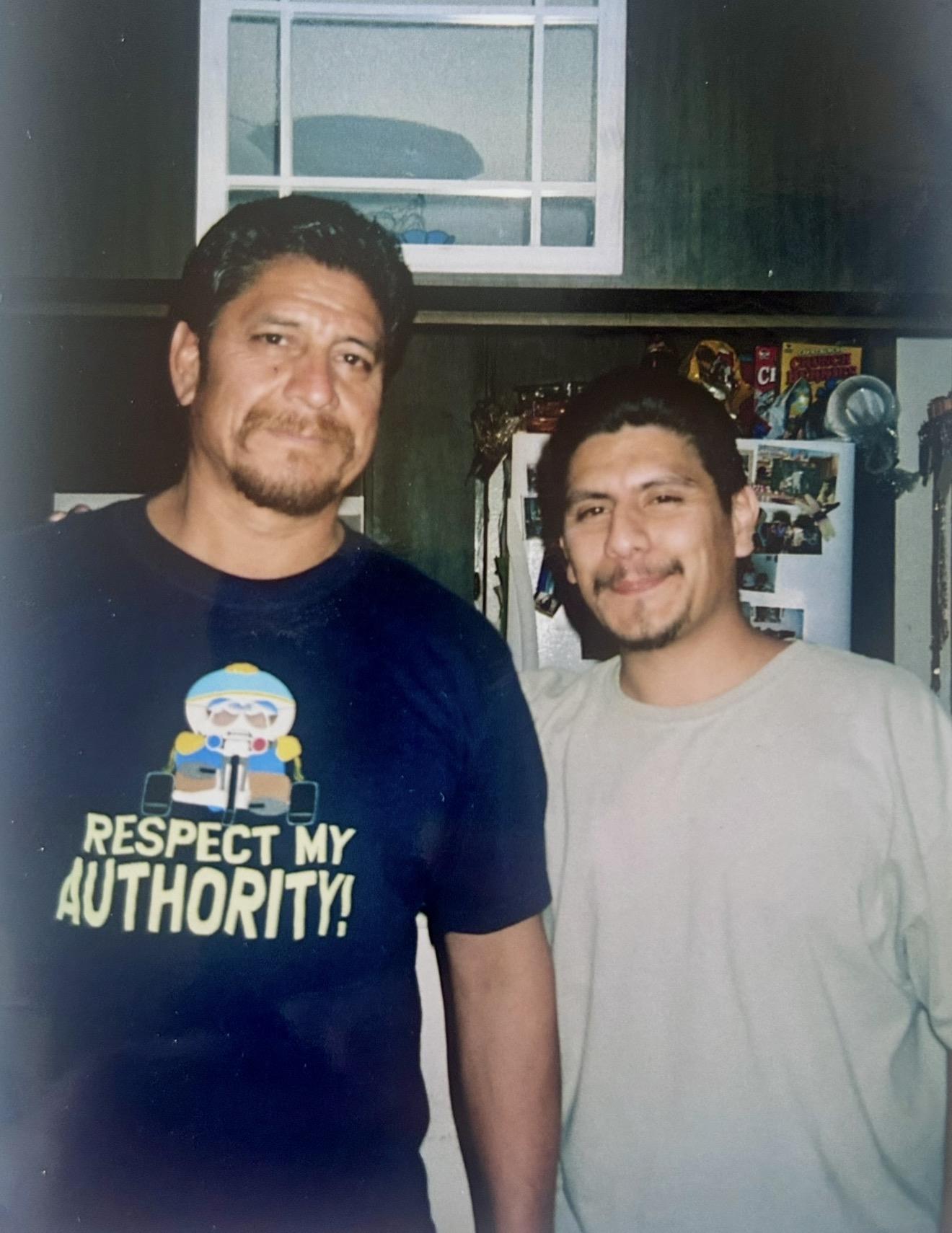 Two men standing together smiling
