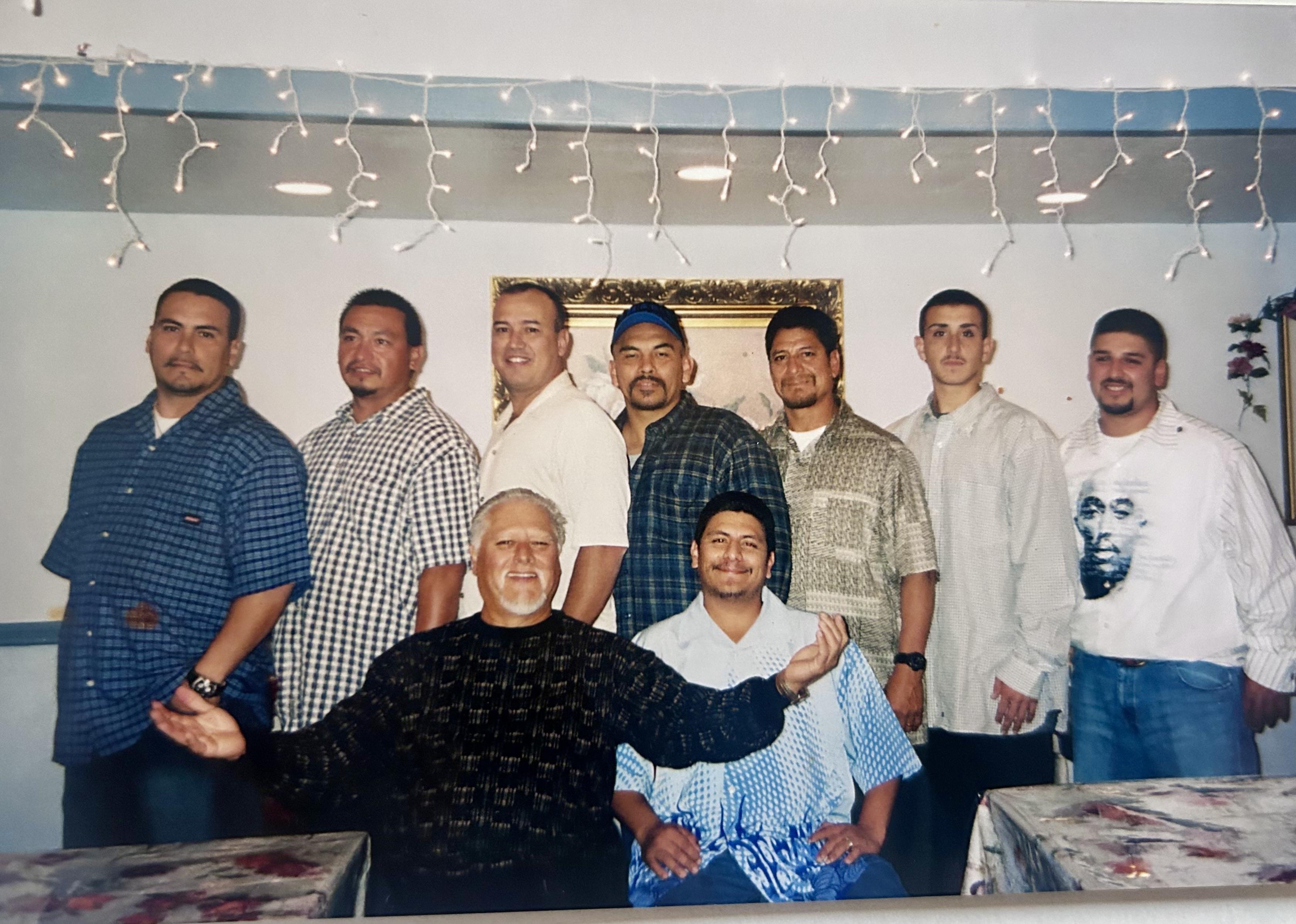 A group of men posing for a photo