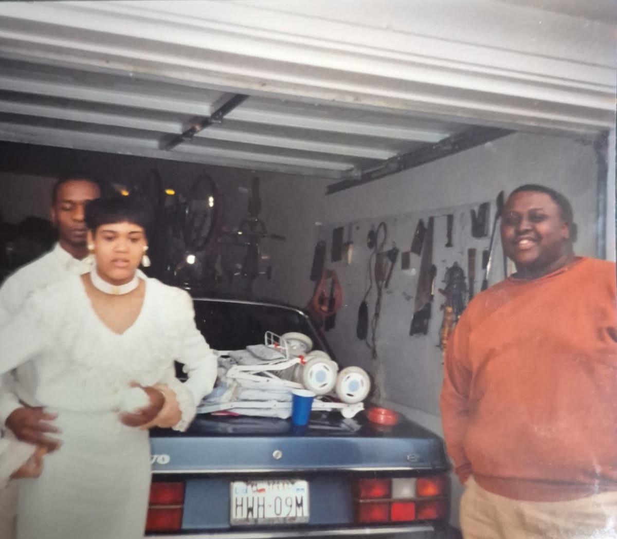 A group of people standing in a garage