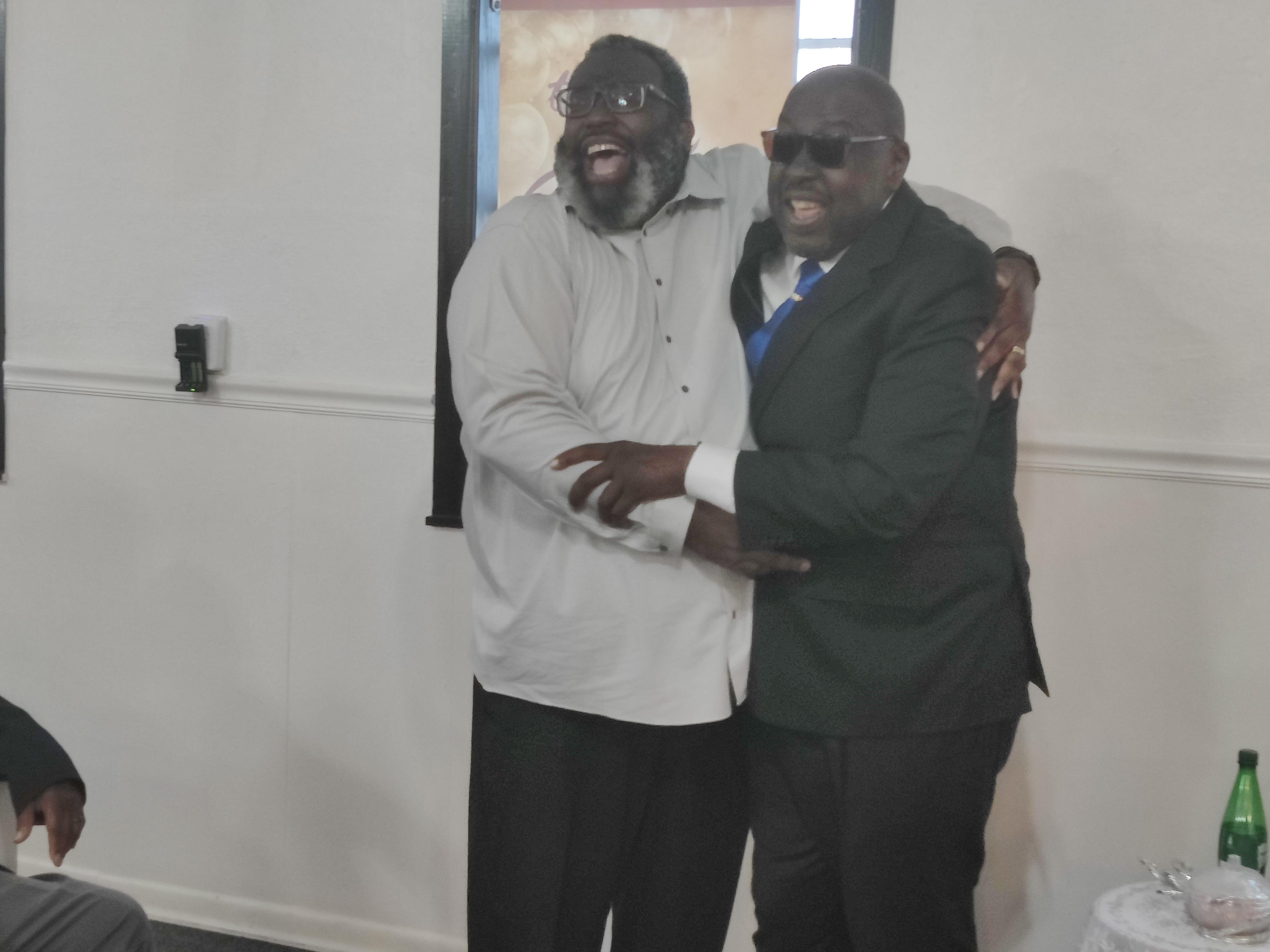 A couple of men hugging
