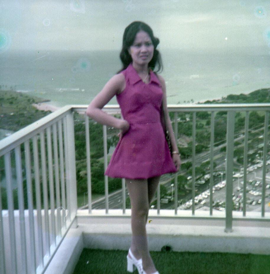 A woman standing on a balcony