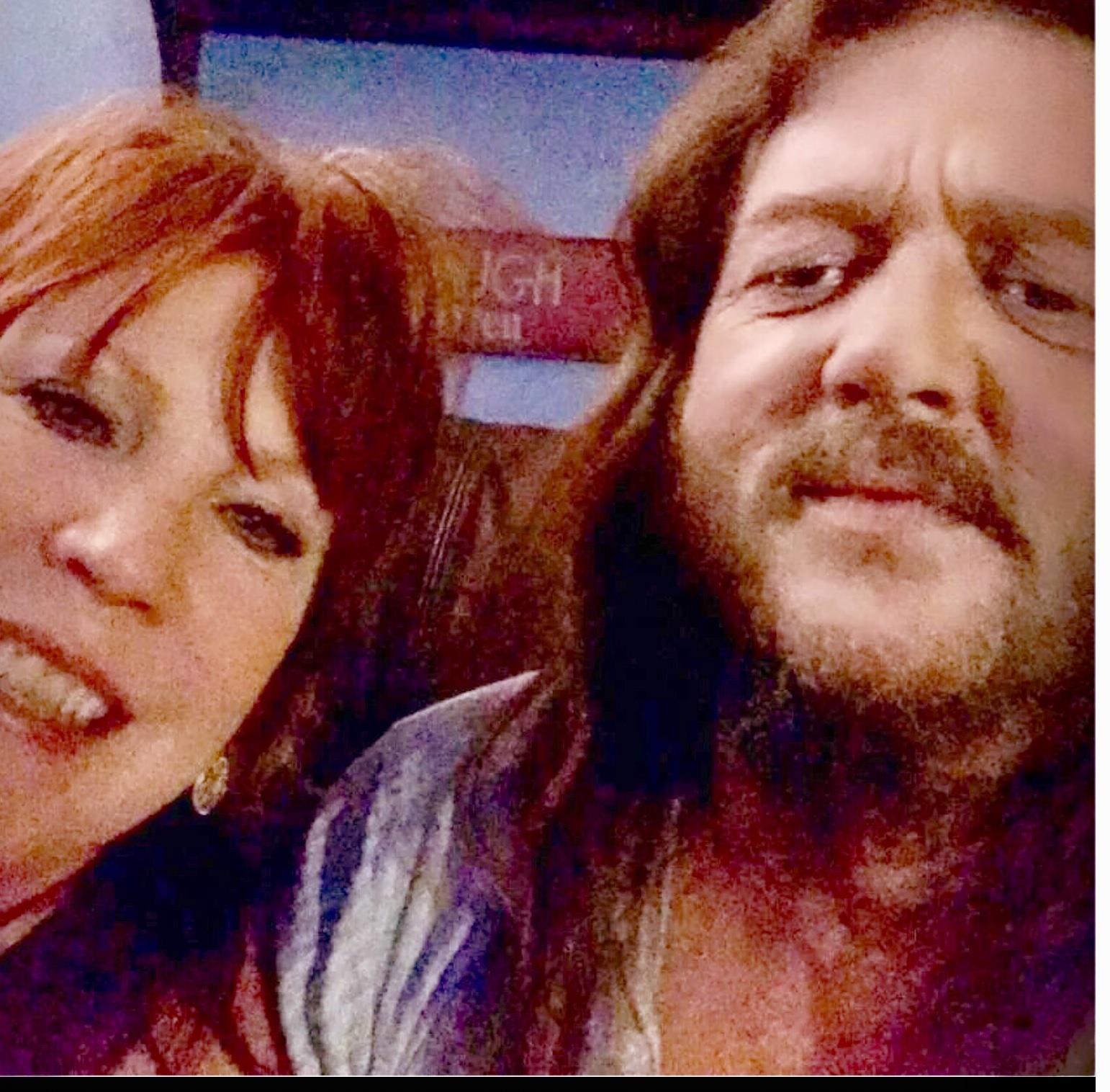 A man and woman taking a selfie
