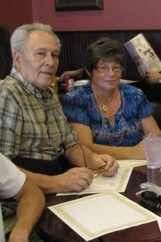 A man and woman sitting at a table