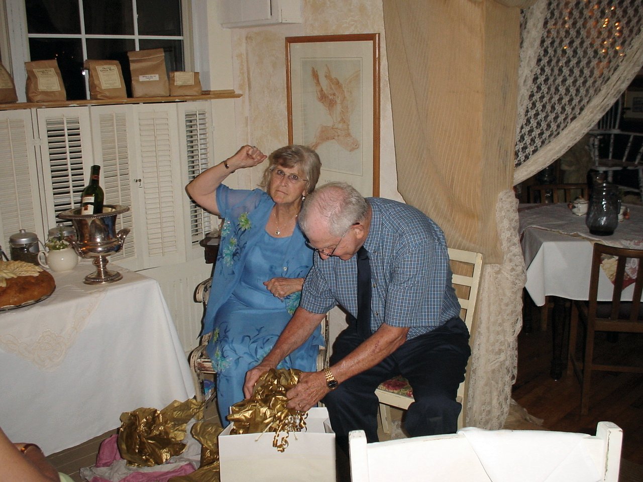 A man and woman sitting in a chair