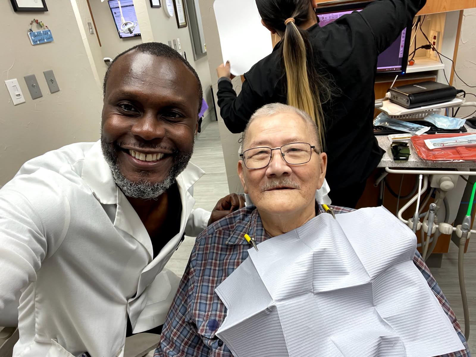 A man and woman smiling for a selfie