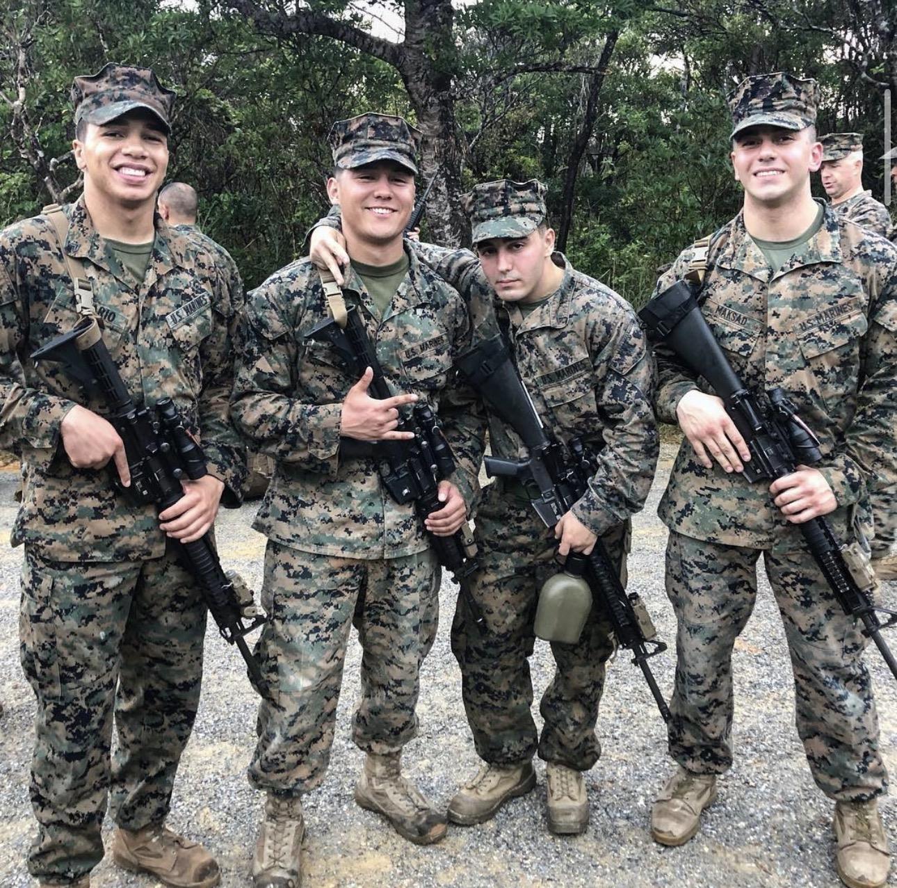 A group of men in military uniforms holding guns