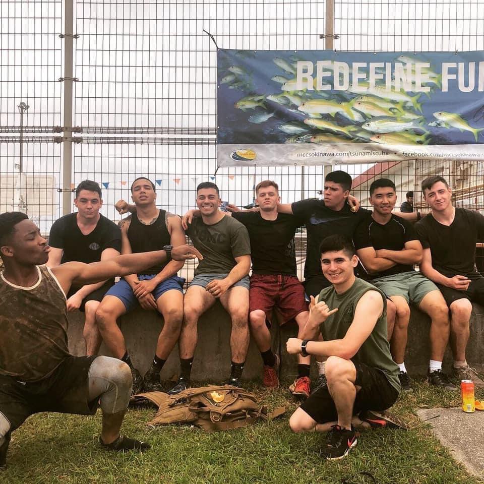A group of men posing for a photo