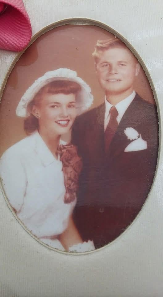 A man and woman in wedding attire