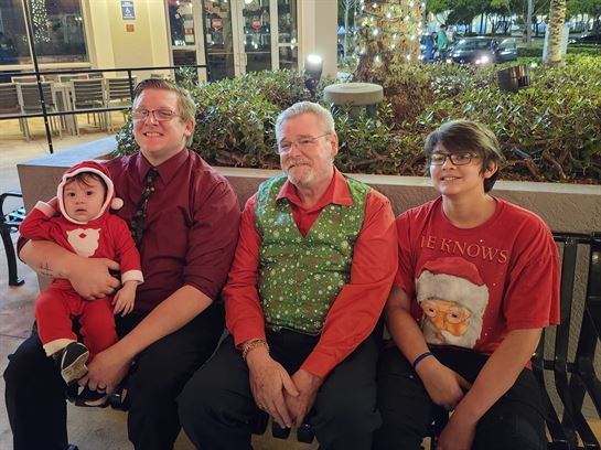 A group of people sitting on a bench