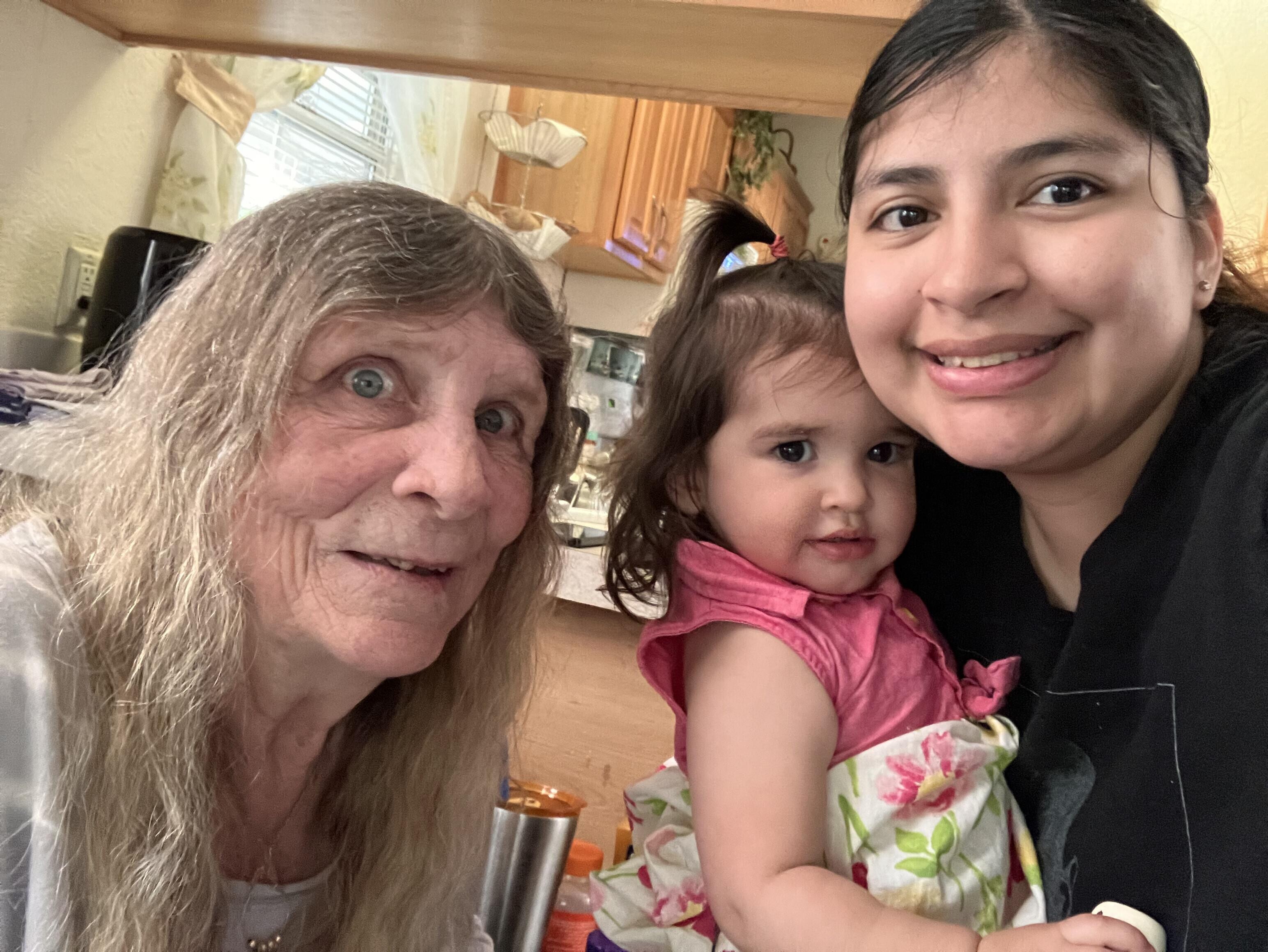 A group of women and a baby