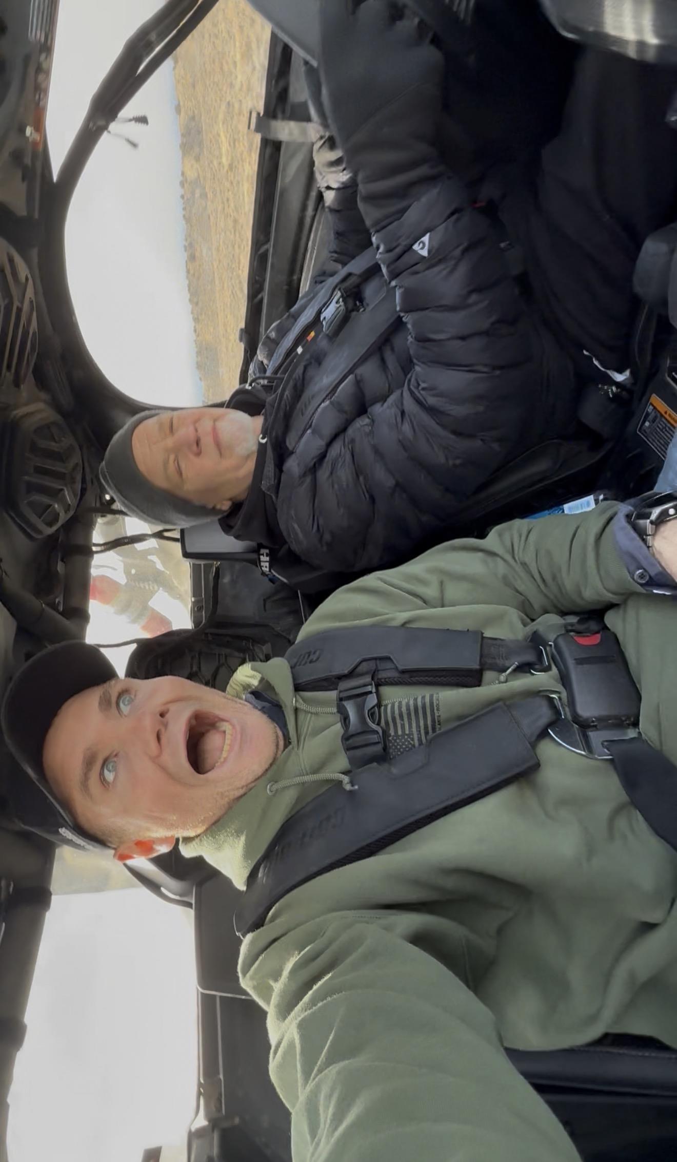 A man in a car with his mouth open