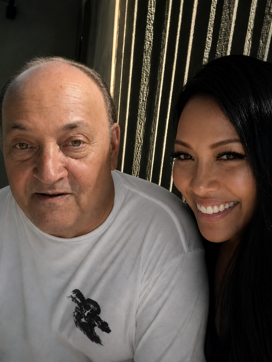 A man and woman smiling for a selfie