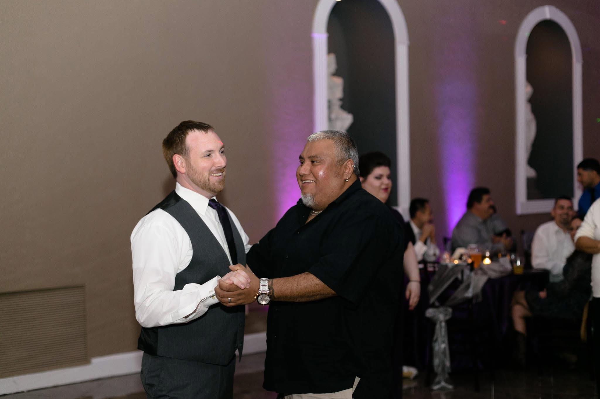 A man shaking hands with another man