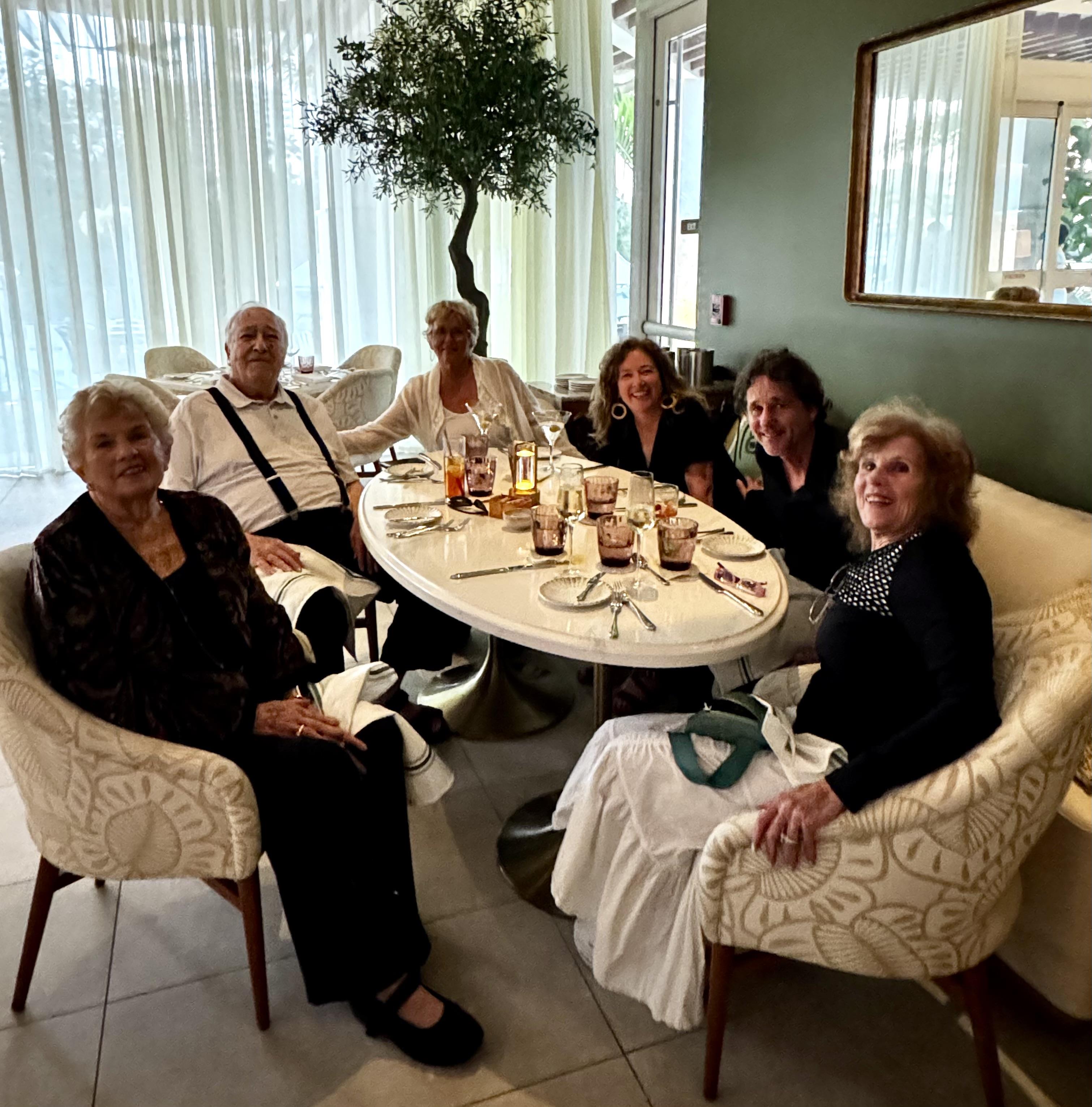 A group of people sitting around a table