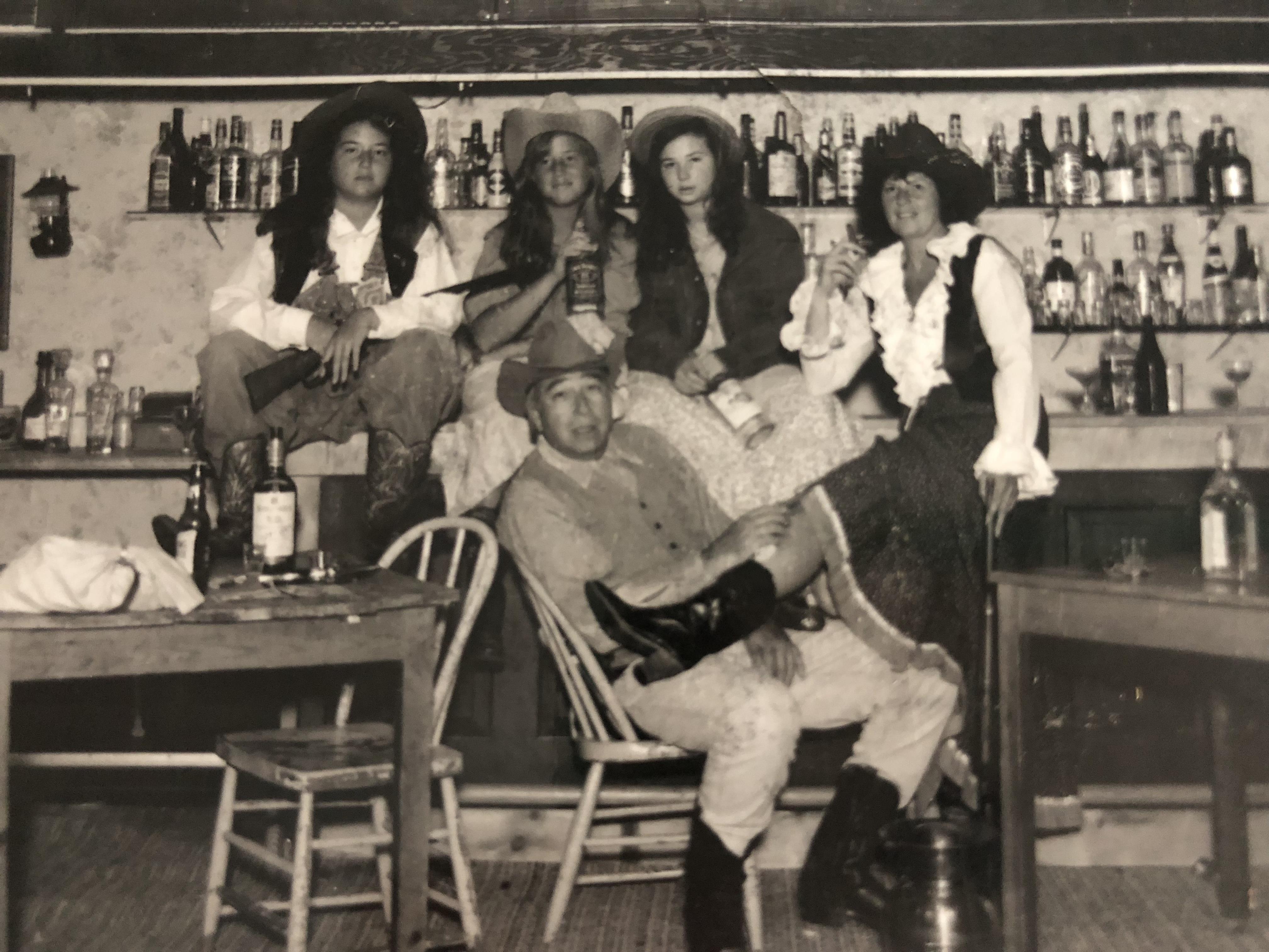 A group of people in cowboy outfits