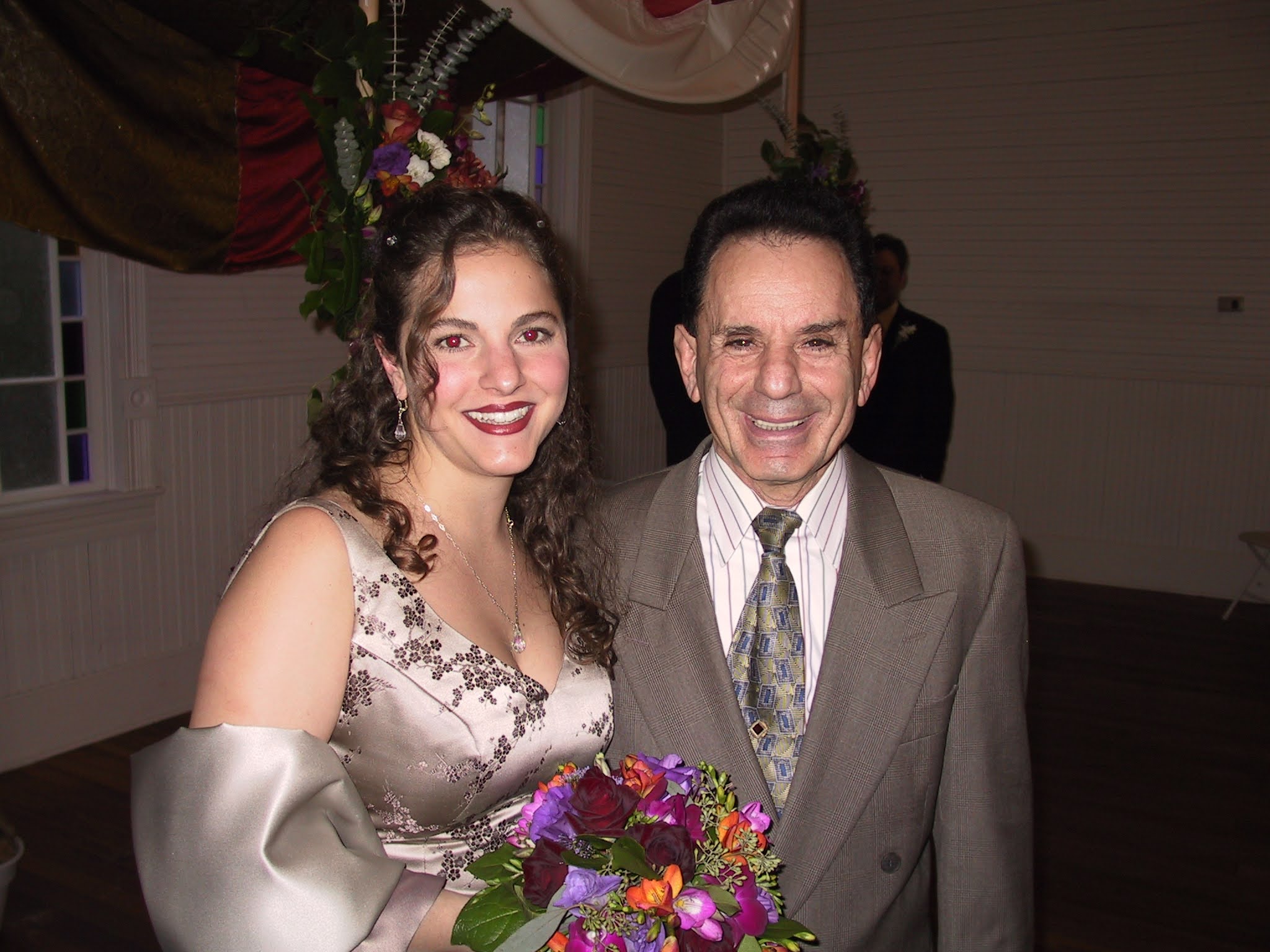 A man and woman posing for a picture
