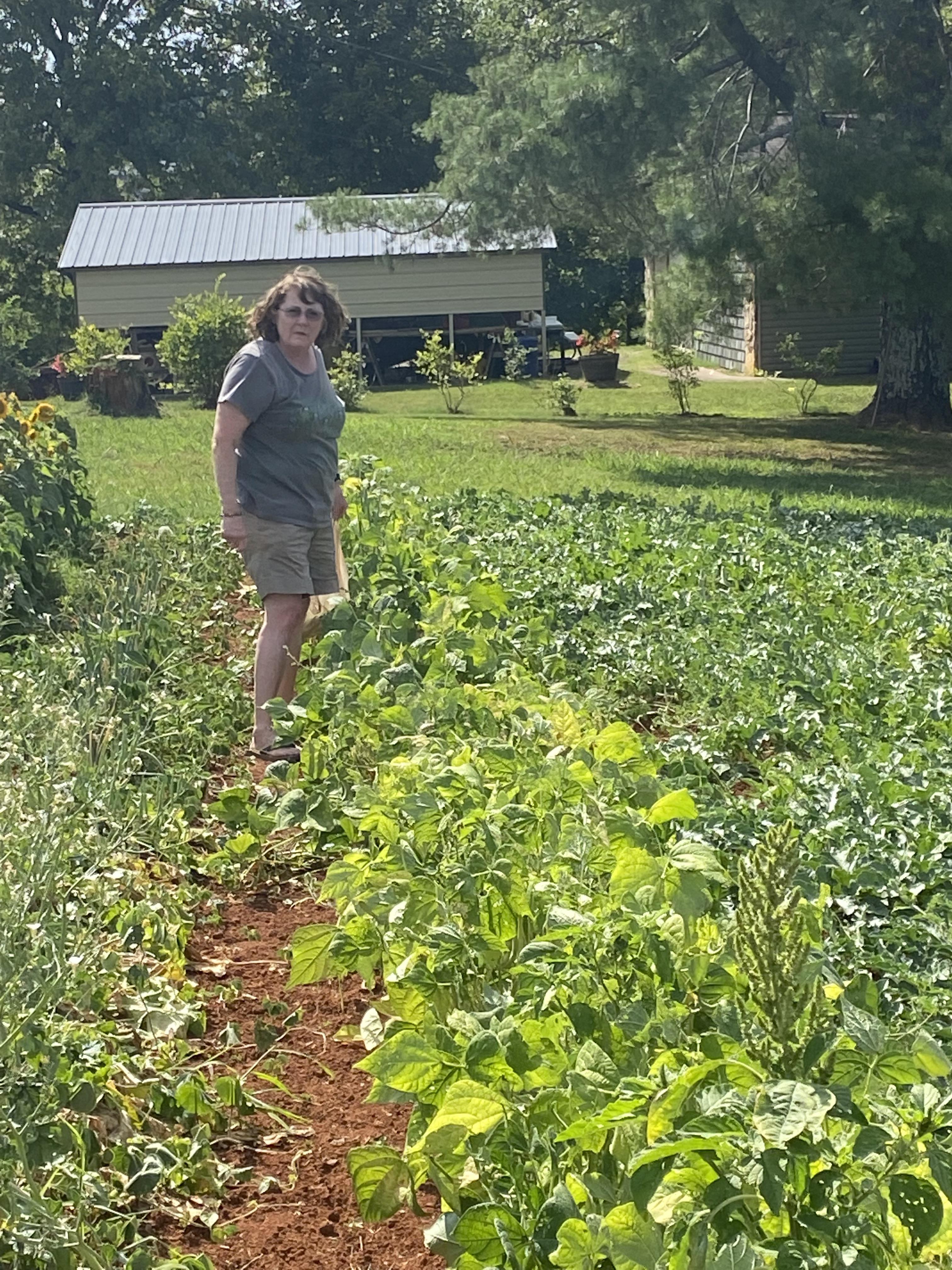 A woman standing in a garden