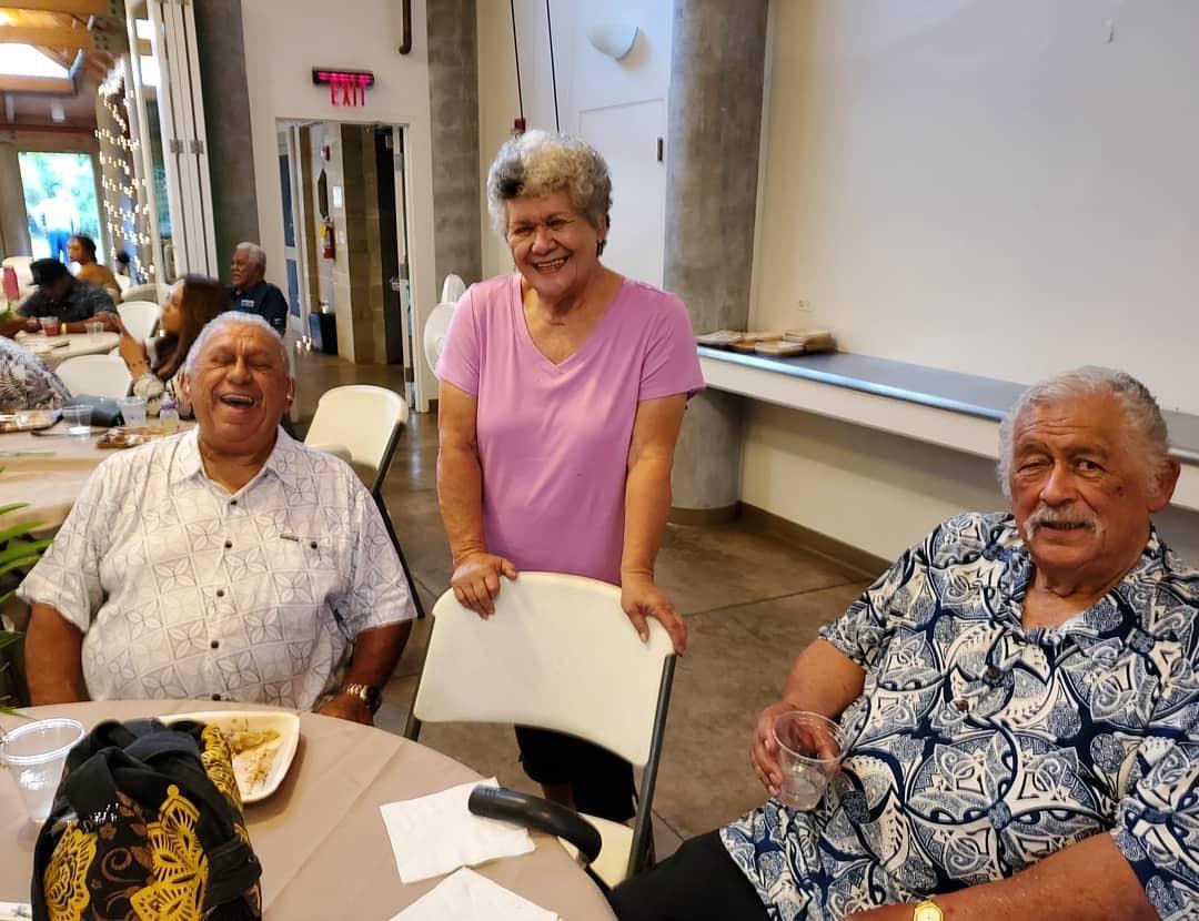 A group of people sitting at a table