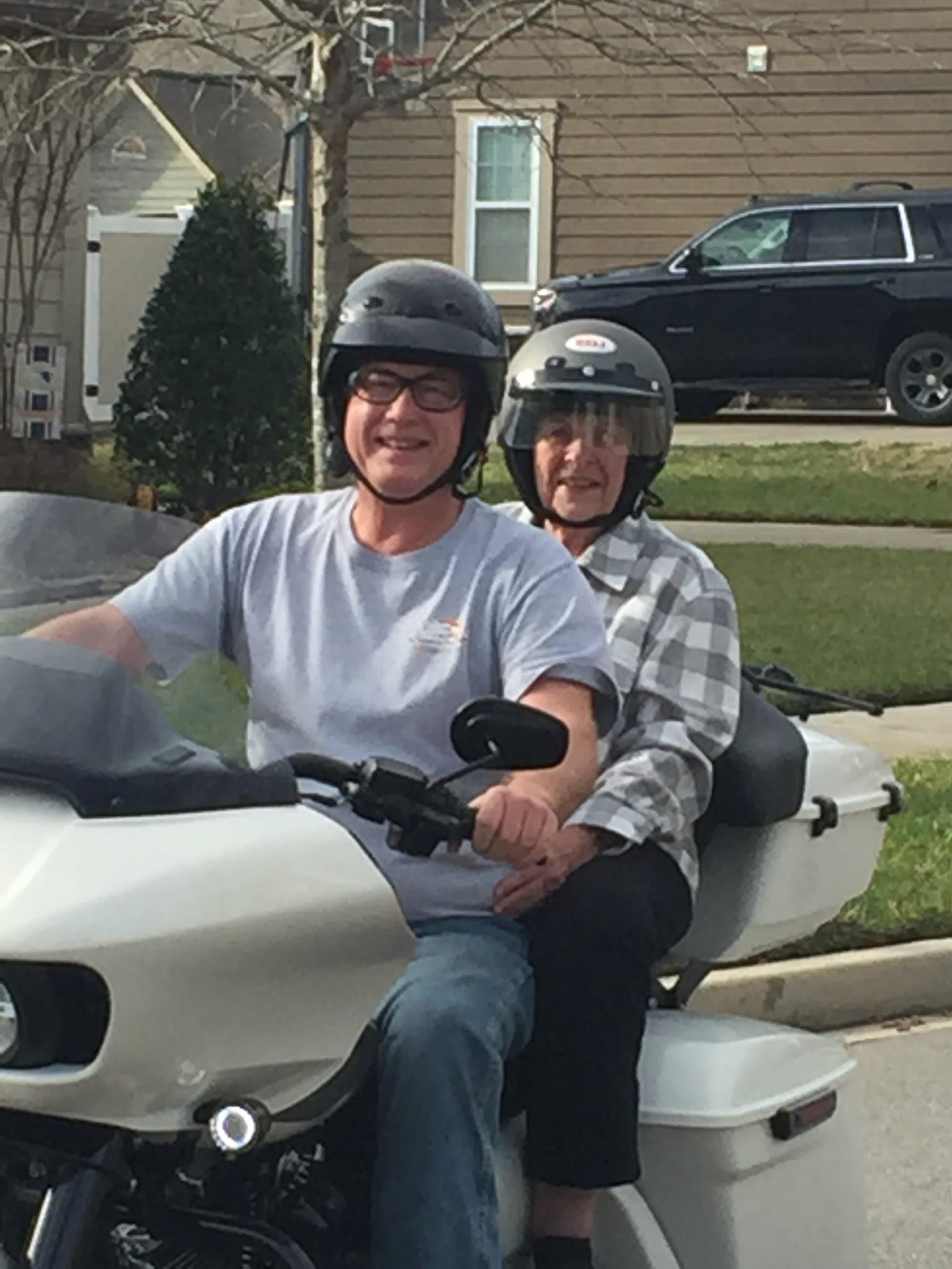 A man and woman on a motorcycle