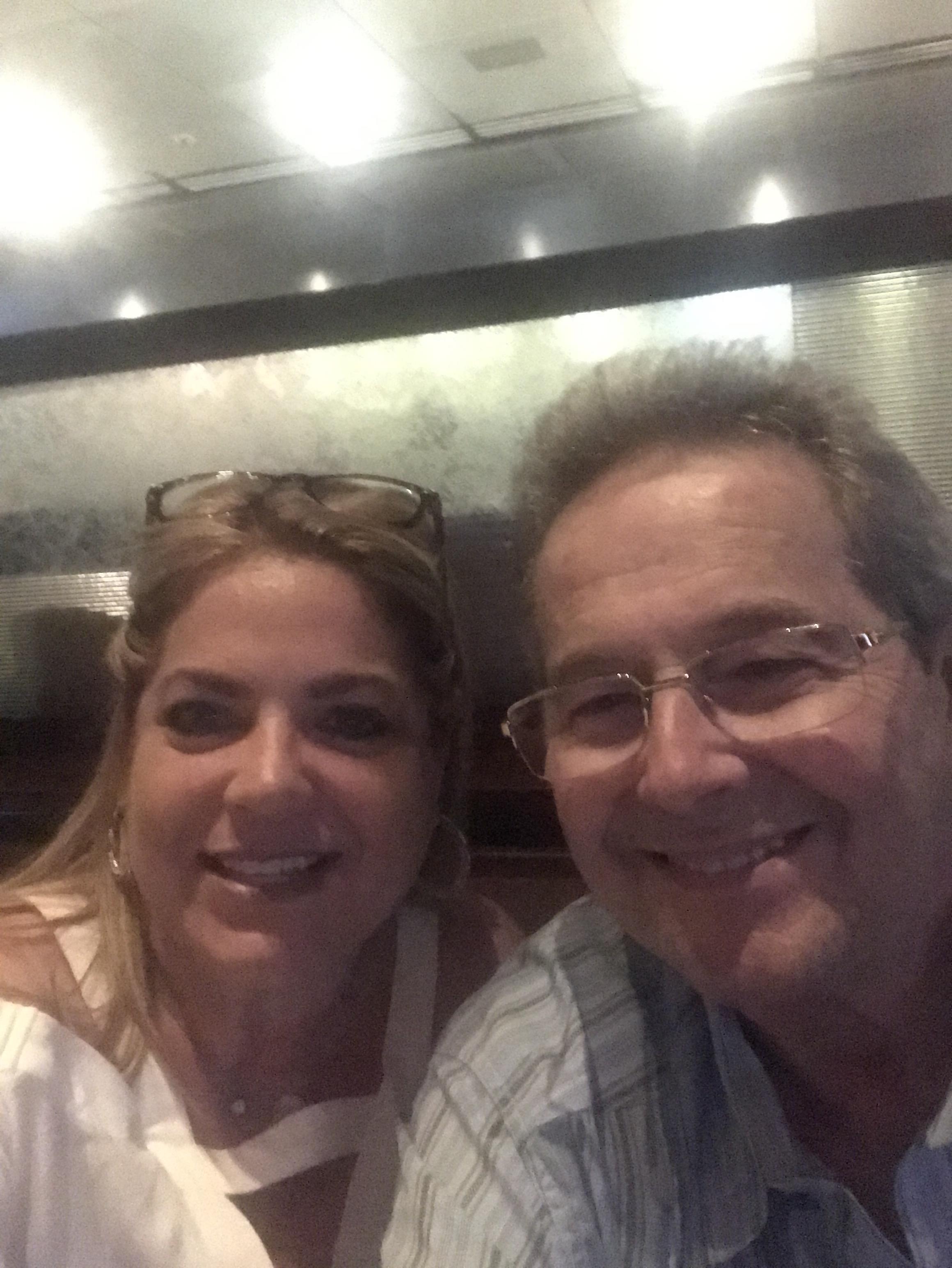 A man and woman taking a selfie
