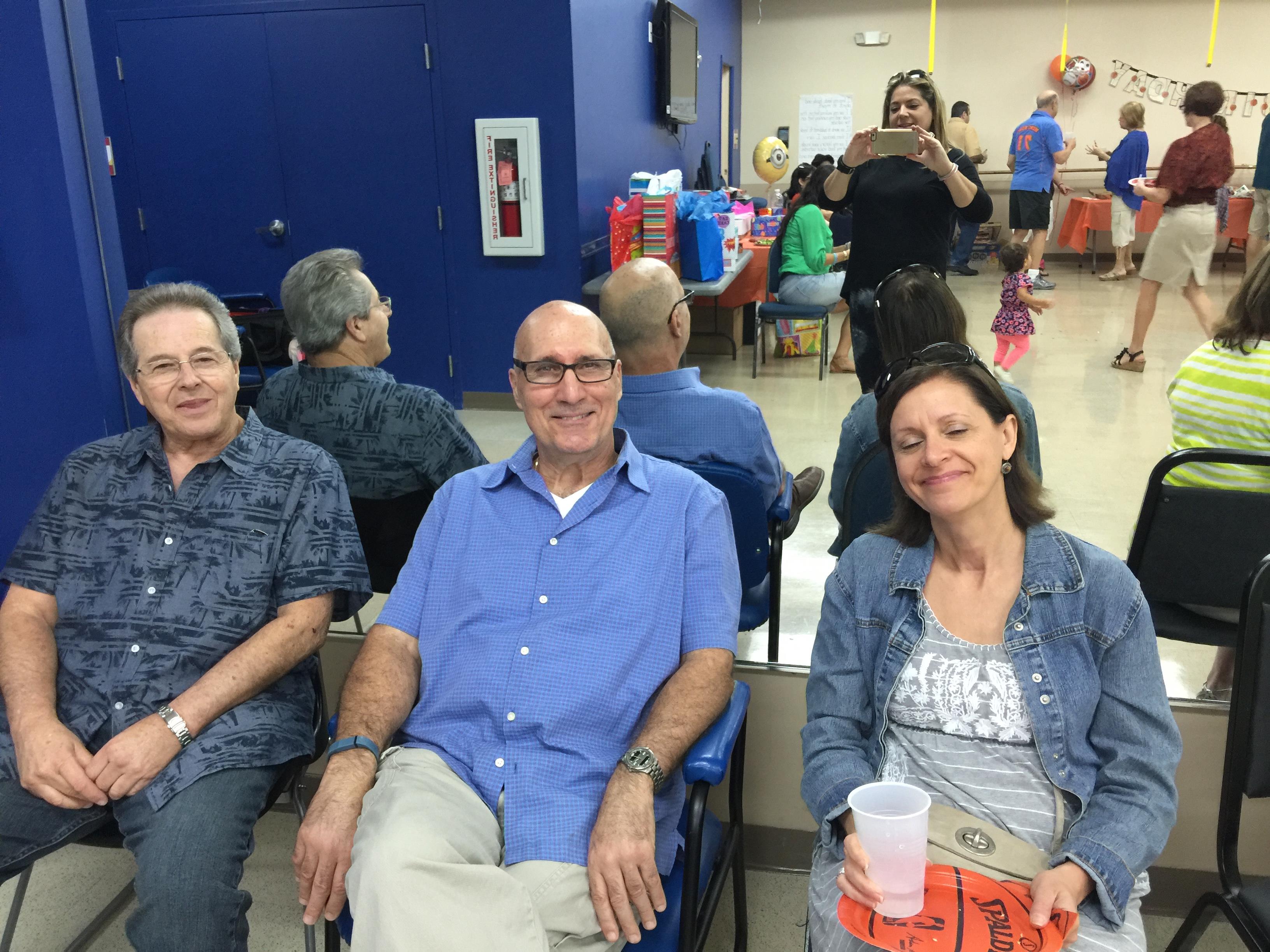 A group of people sitting in chairs