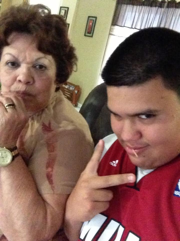 A woman and a boy posing for a selfie
