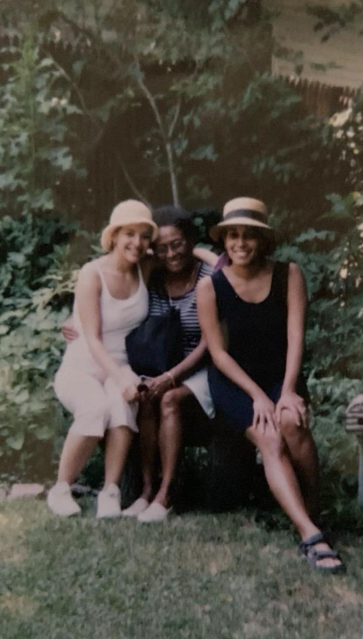 A group of women sitting on a bench