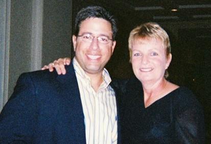 A man and woman smiling at camera