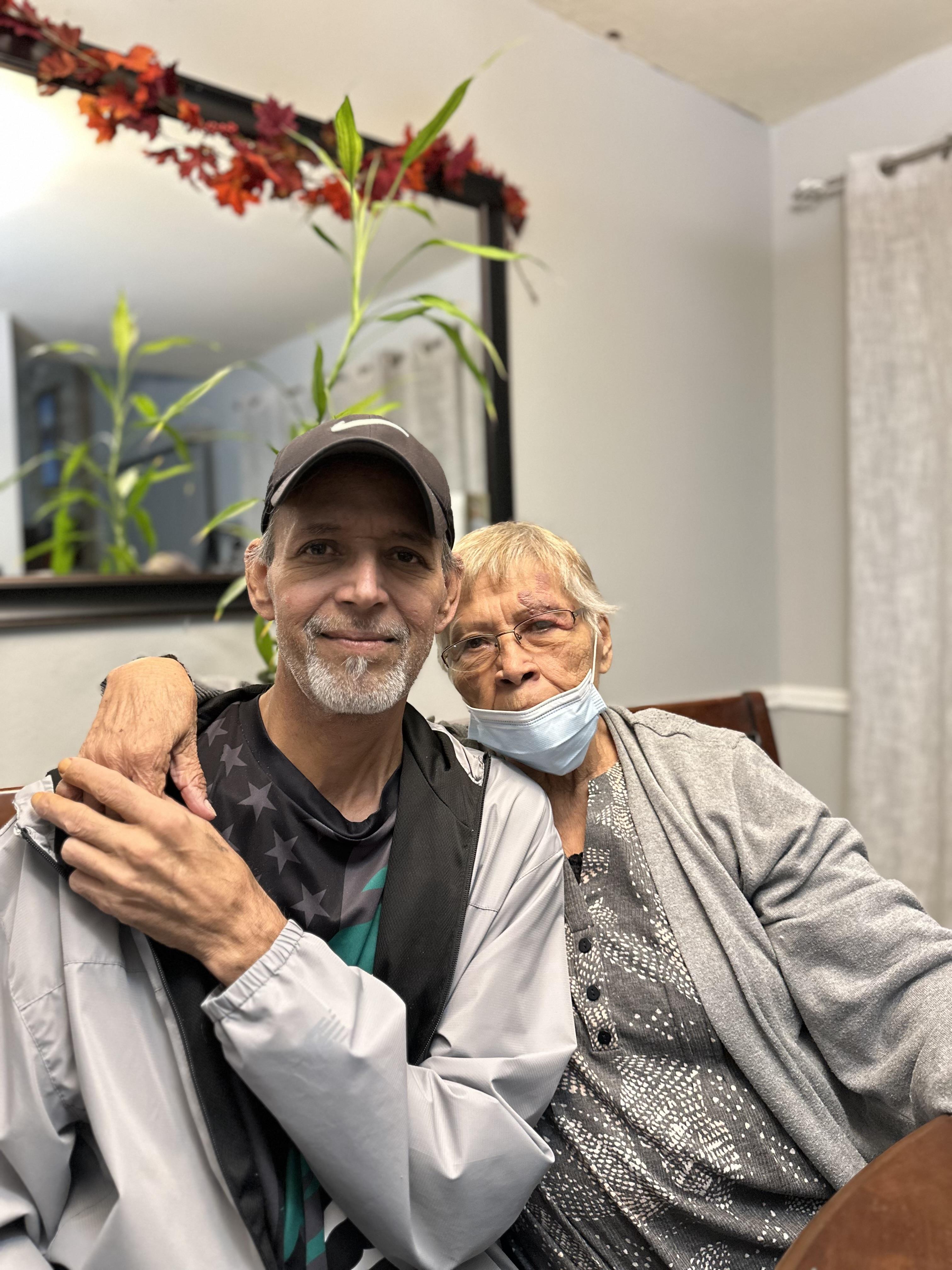 A man and woman wearing face masks