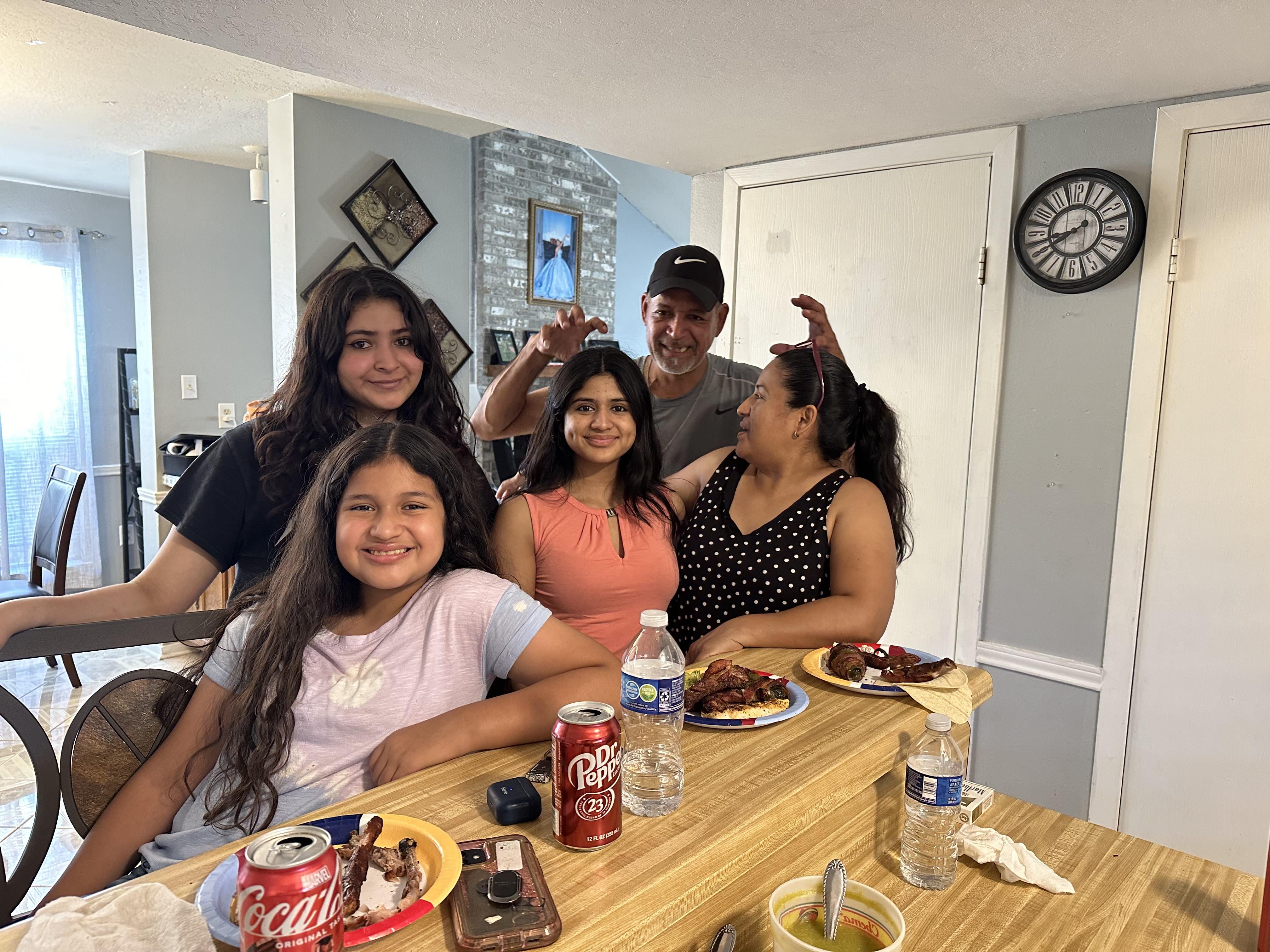 A group of people sitting at a table