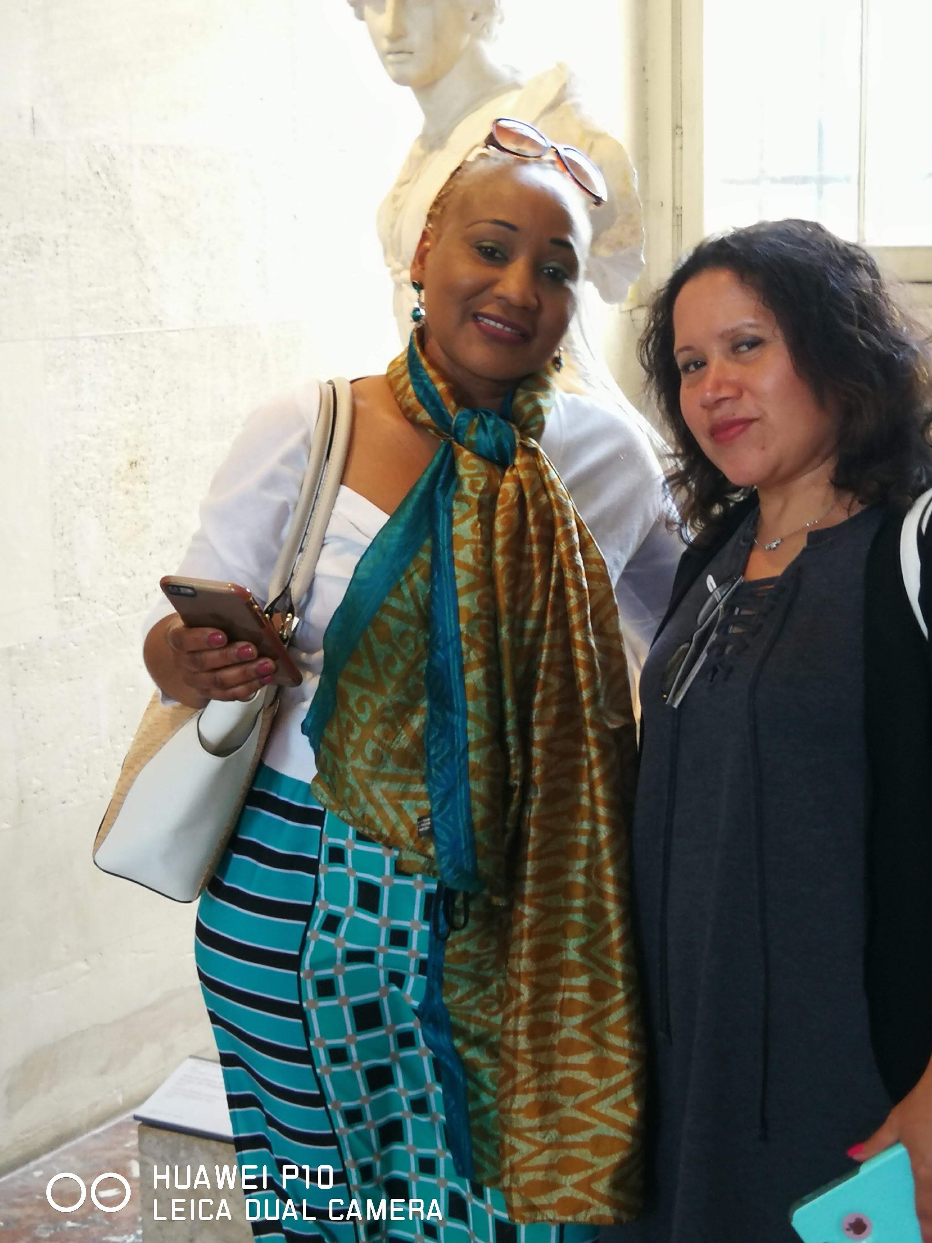 A couple of women posing for a picture