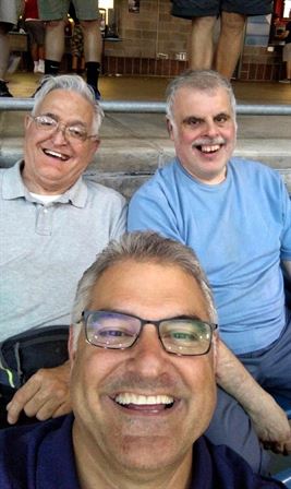 A group of men smiling for a selfie