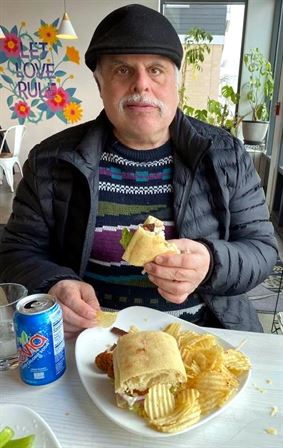 A man eating a burrito