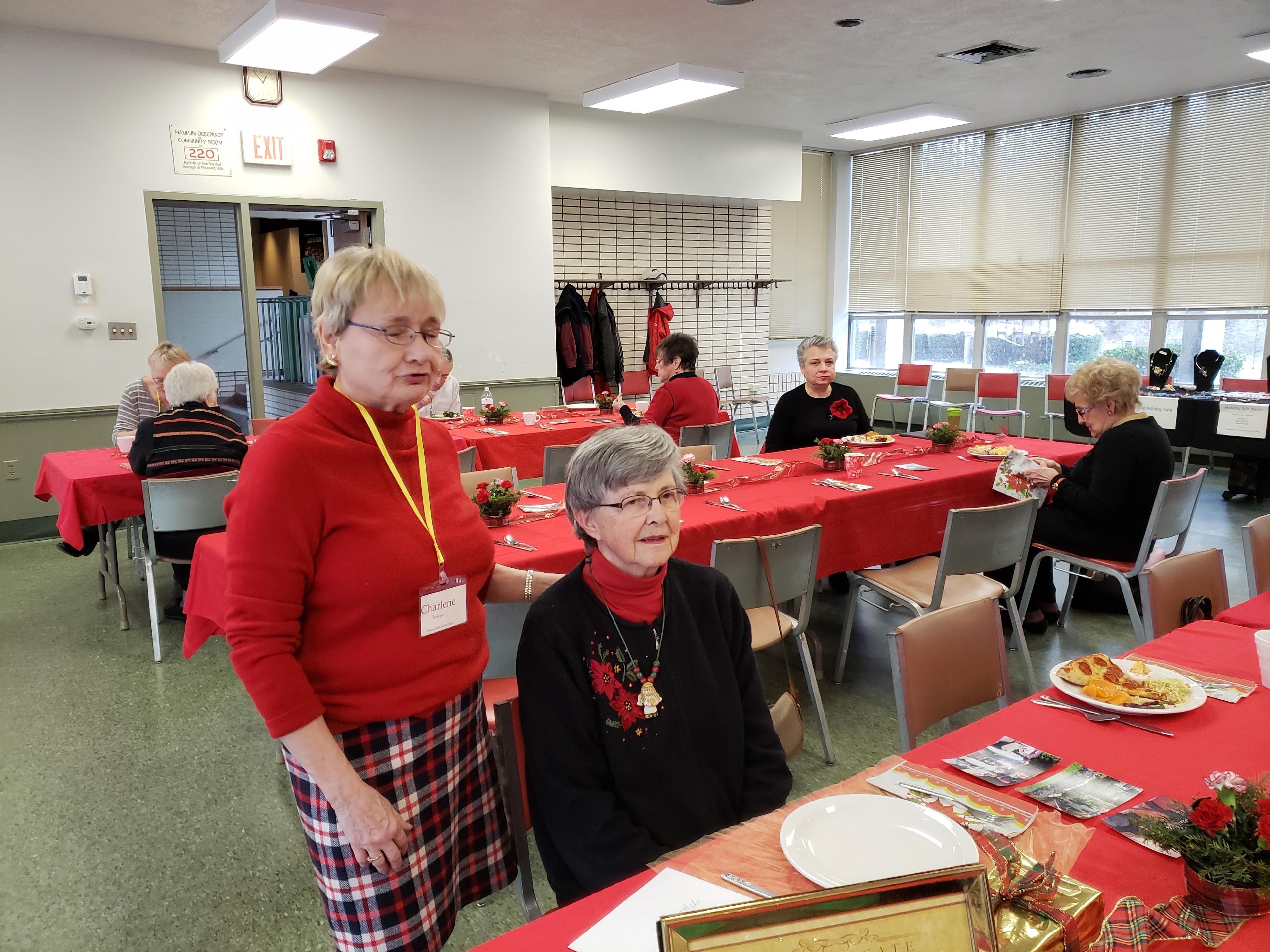 A group of people sitting at tables