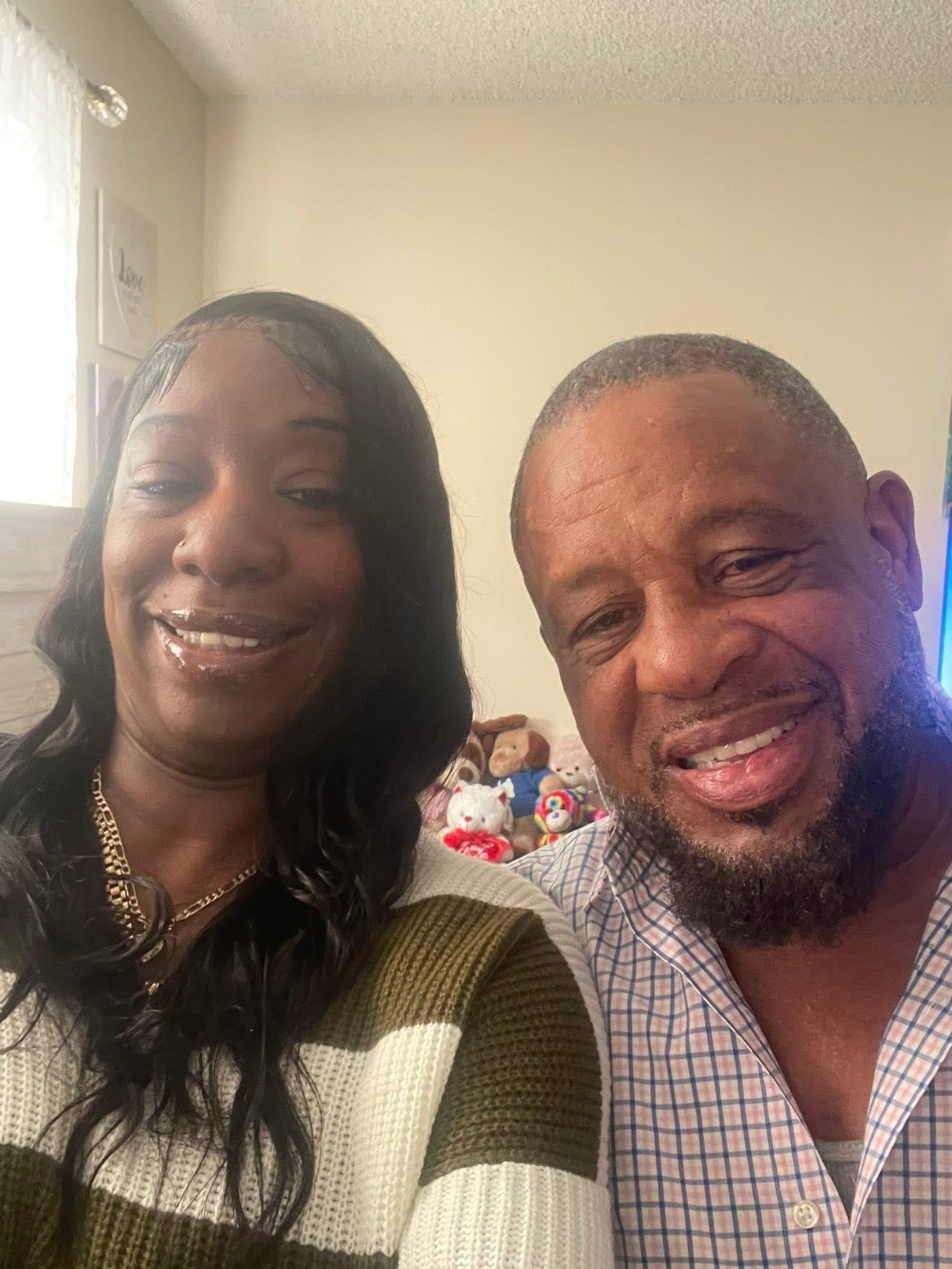 A man and woman smiling for a selfie