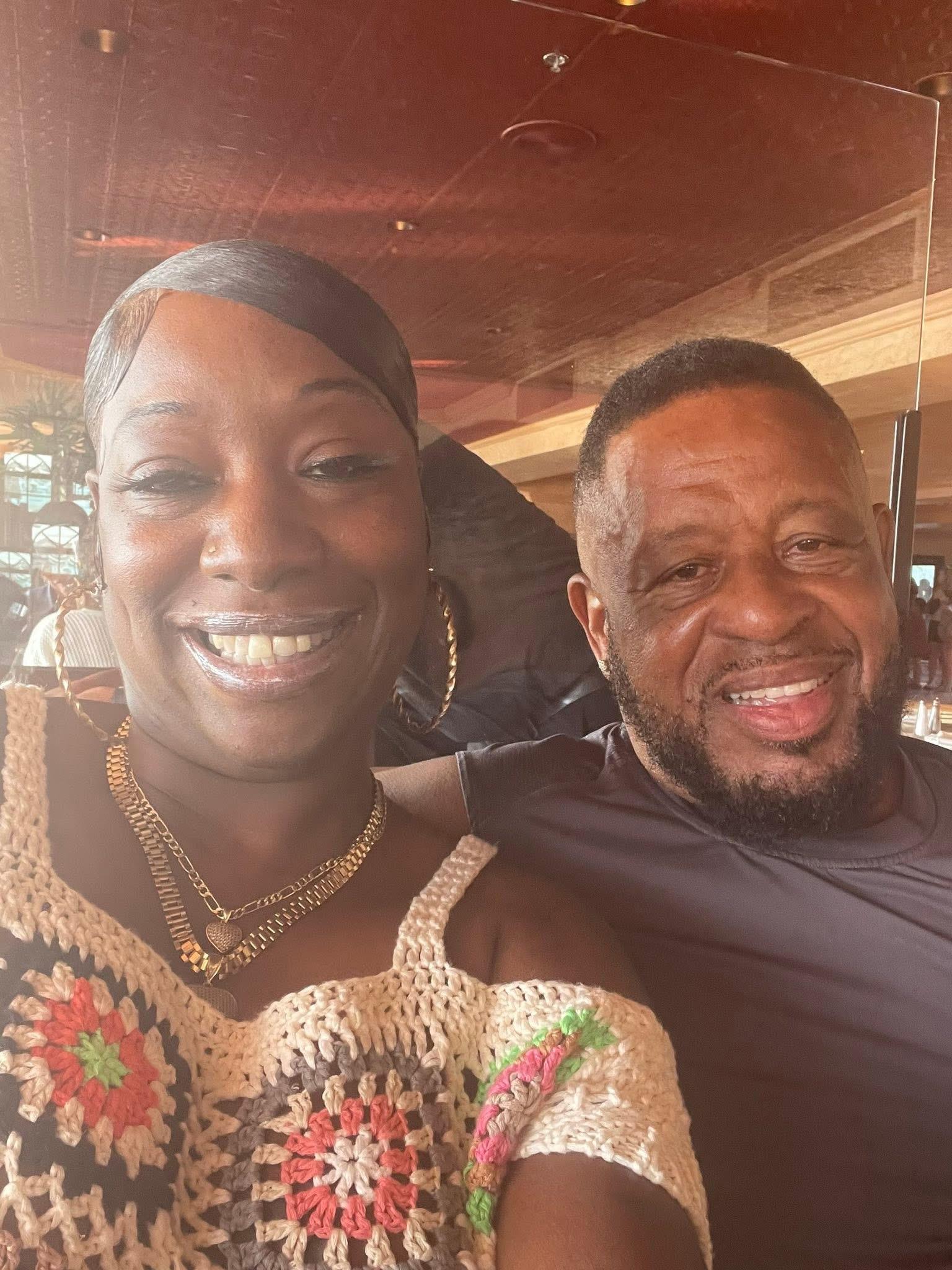 A man and woman smiling for a selfie