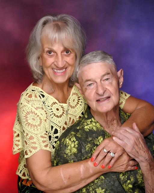 A man and woman posing for a picture