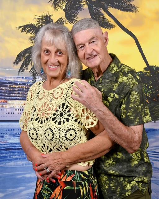 A man and woman posing for a picture